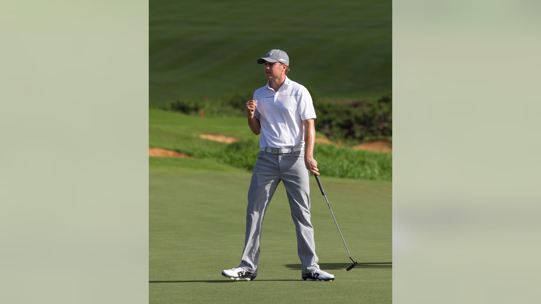 Jordan Spieth reacts to his putt at the end of his final round of the Tournament of Champions golf tournament, Monday, Jan. 6, 2014, in Kapalua, Hawaii. (AP Photo/Marco Garcia)