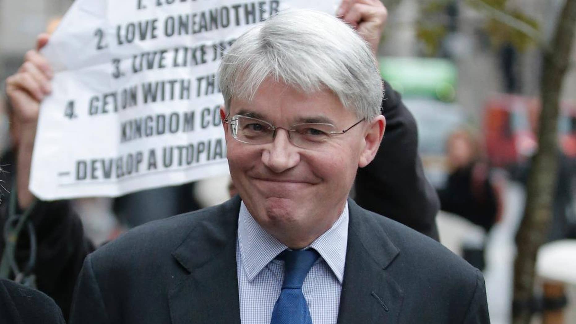 Andrew Mitchell, Britain's former government chief whip, arrives at the Royal Courts of Justice in central London, Monday, Nov. 17, 2014. Mitchell is suing News Group Newspapers over a Sept. 2012 article in the Sun newspaper about an incident which concerned a verbal exchange at the gate in Downing Street between Mitchell and police officer Toby Rowland. Mitchell is himself being sued by Rowland in respect of statements he made from Dec. 2012 onwards.(AP Photo/Lefteris Pitarakis)