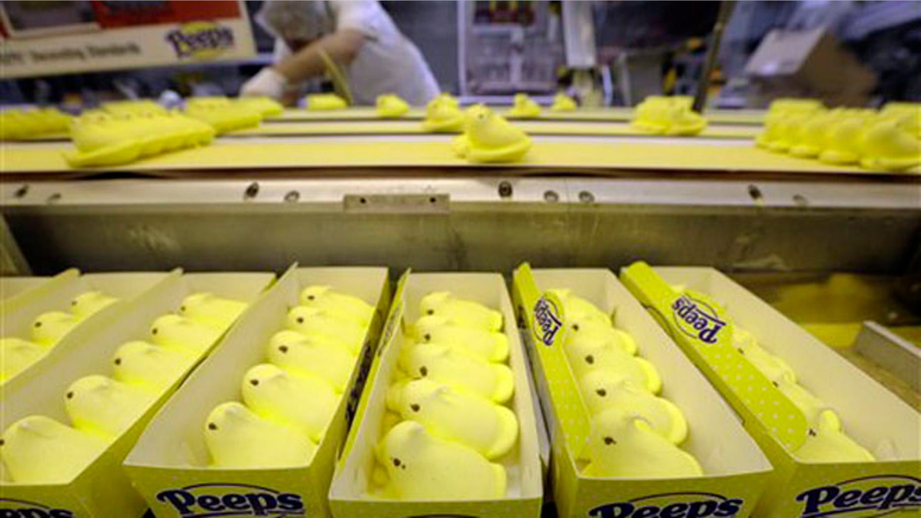 In this Wednesday, Feb. 13, 2013 photo Peeps move through the manufacturing process, at the Just Born factory in Bethlehem, Pa. With the storied candy brand celebrating its 60th anniversary this year, a quirky new TV ad campaign talks about all the things people do with their Peeps. (AP Photo/Matt Rourke)