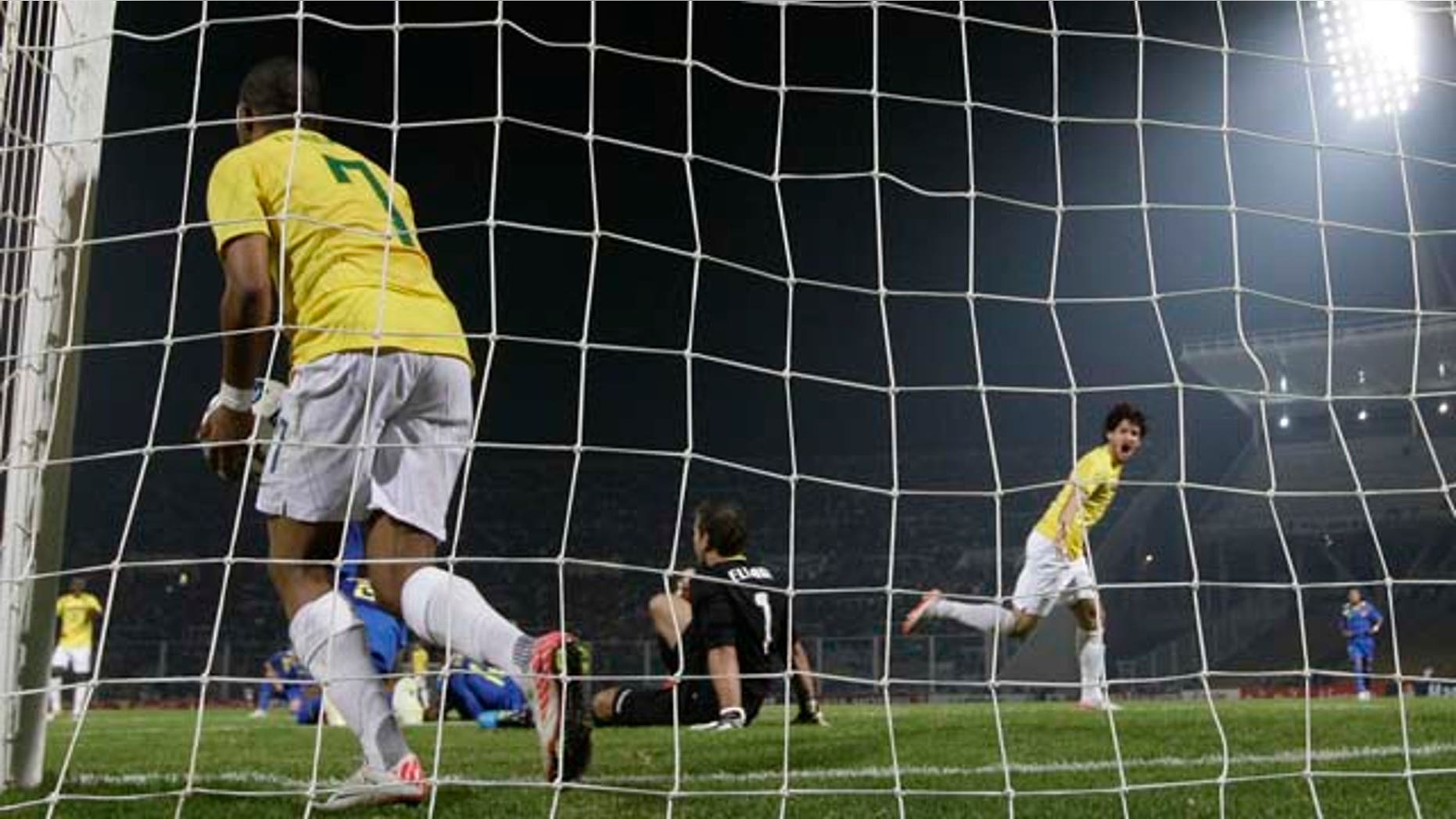 Brazil's Robinho, left, takes the ball as Brazil's Alexandre Pato, right, celebrates after he scored during a Group B Copa America soccer match in Cordoba, Argentina, Wednesday July 13, 2011. (AP Photo/Fernando Vergara)