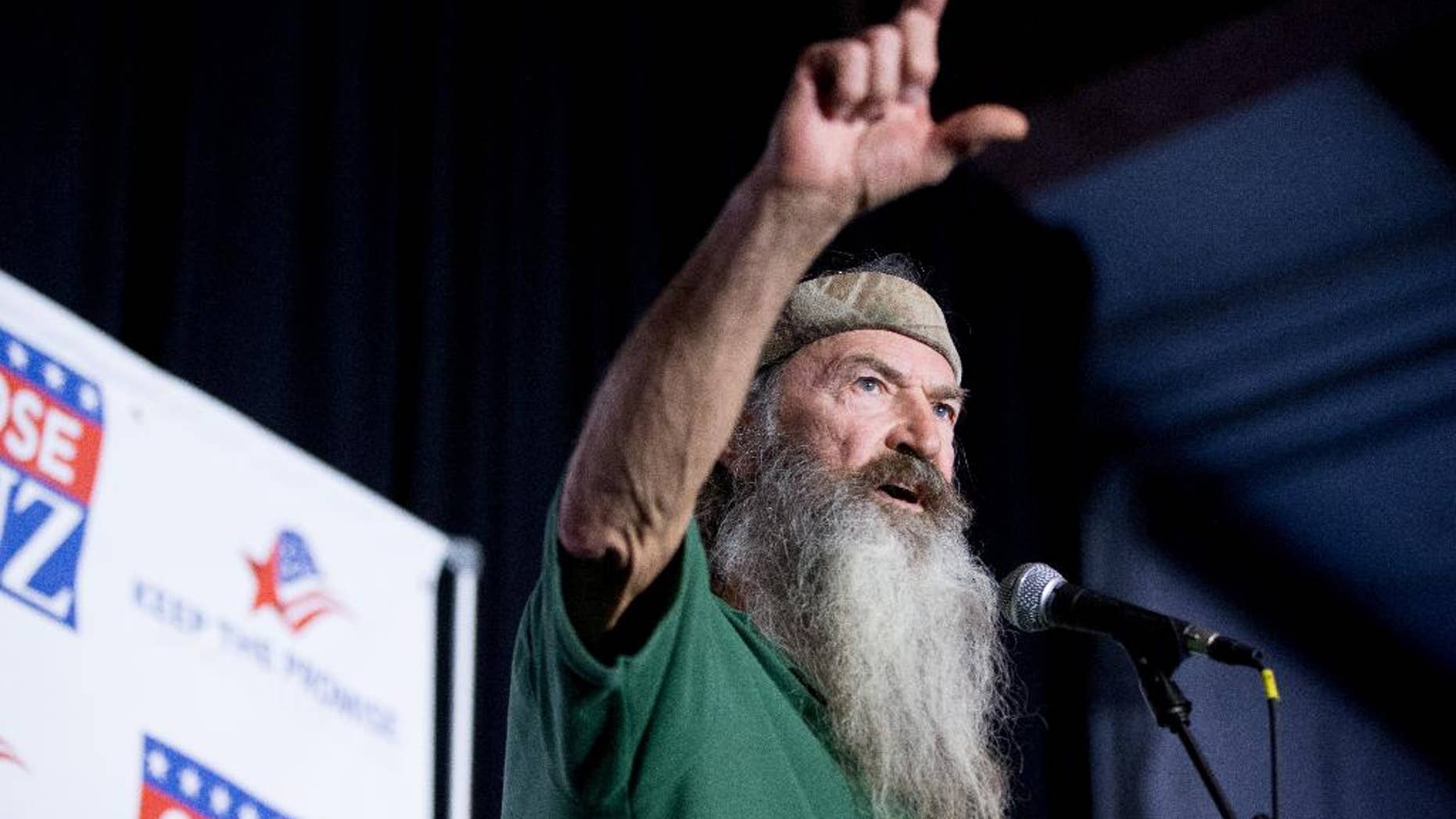 FILE - In this Feb. 19, 2016 file photo, Phil Robertson of the Duck Dynasty reality television program speaks at a rally for Republican presidential candidate, Sen. Ted Cruz, R-Texas, at Eagle Aviation Hangar in Columbia, S.C. Robertson has again clouded NASCAR's image as a sport trying to remove itself from its divisive stereotypes. Robertson called for a "Jesus man in the White House" during what was supposed to be a simple prayer before the race at Texas Motor Speedway on Saturday, April 9. (AP Photo/Andrew Harnik, File)
