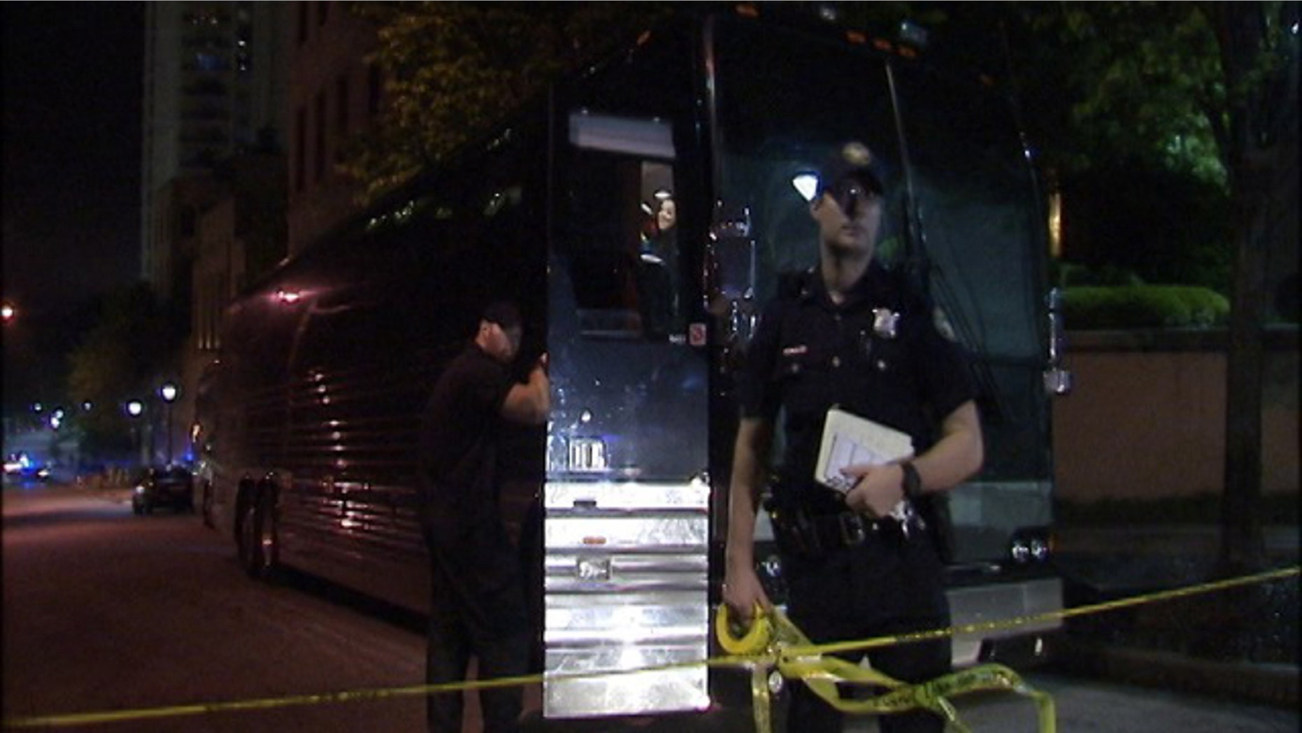 April 26, 2015: Atlanta police rope off one of two buses that was struck by gunfire early Sunday. Rapper Lil Wayne was unhurt after someone opened fire on his tour bus following a performance at an Atlanta night club. (MyFoxAtlanta.com)