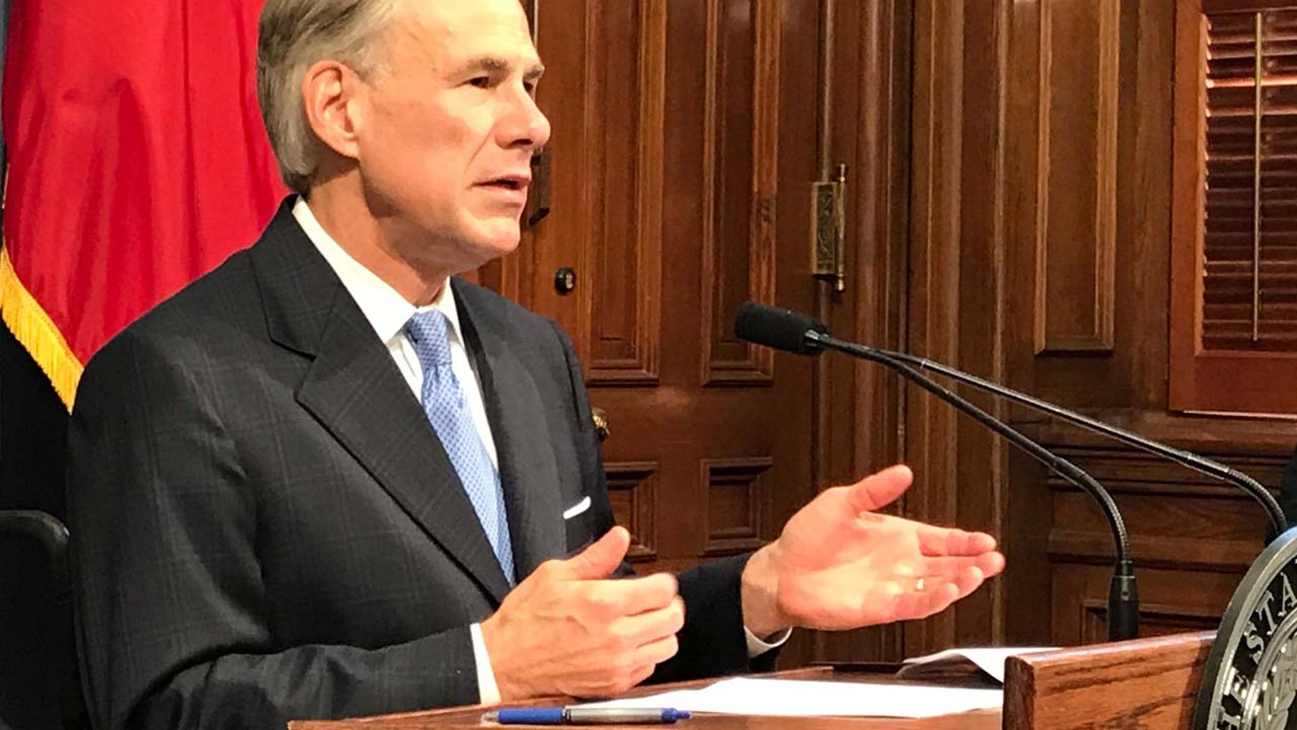 FILE: Texas Governor Greg Abbott speaks at a news conference in Austin, Texas