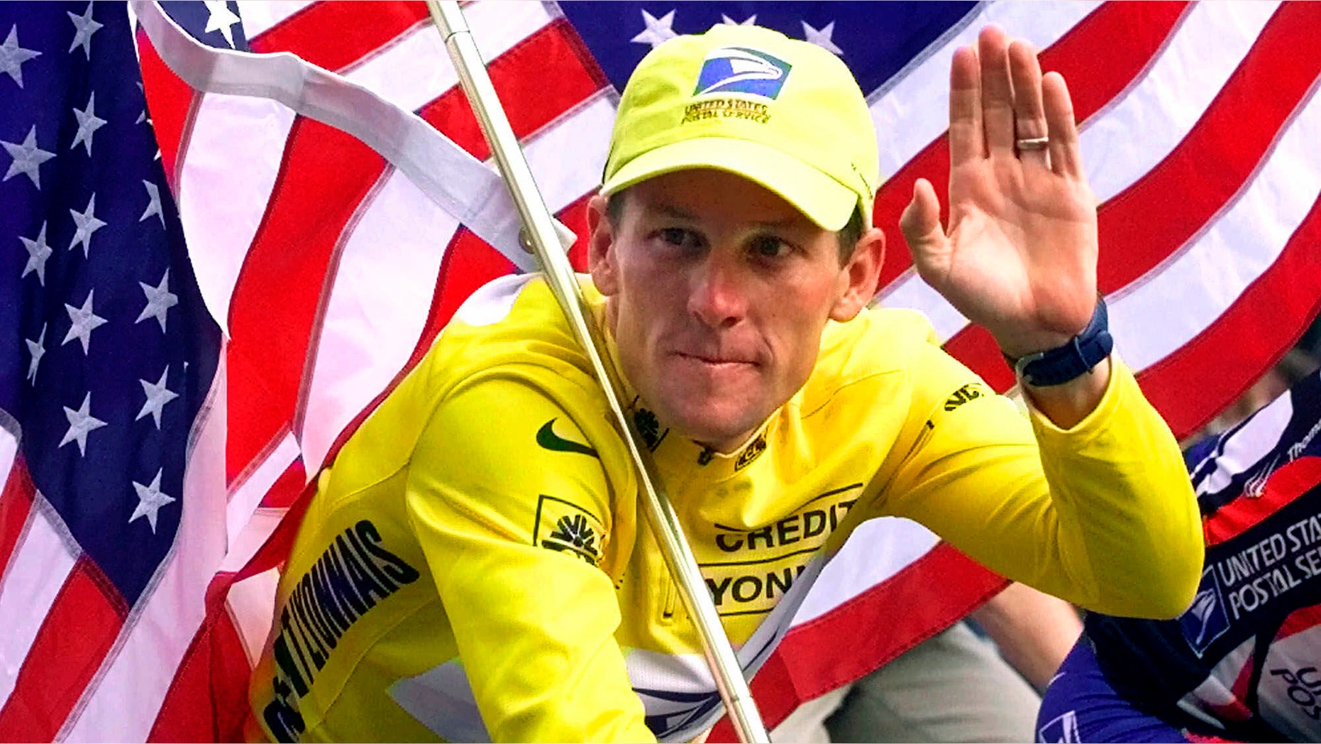 FILE - In this July 23, 2000, file photo, winner Lance Armstrong rides down the Champs Elysees after the final stage of the Tour de France cycling race in Paris. Armstrong also won the Prince of Asturias Award in Sports in 2000. Armstrong was stripped of his seven Tour de France titles and banned for life by cycling's governing body following a report from the U.S. Anti-Doping Agency that accused him of leading a massive doping program on his teams. (AP Photo/Laurent Rebours, File)