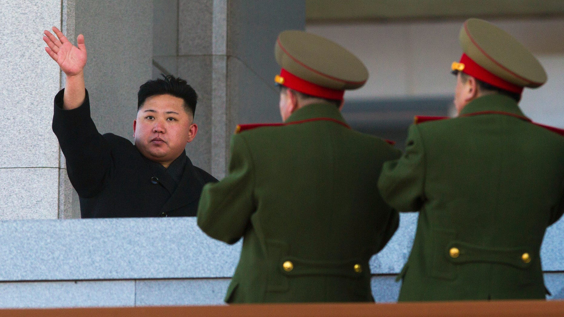 North Korean leader Kim Jong Un waves at Kumsusan Memorial Palace in Pyongyang after reviewing a parade of thousands of soldiers and commemorating the 70th birthday of his late father Kim Jong Il. (AP Photo/David Guttenfelder, File)