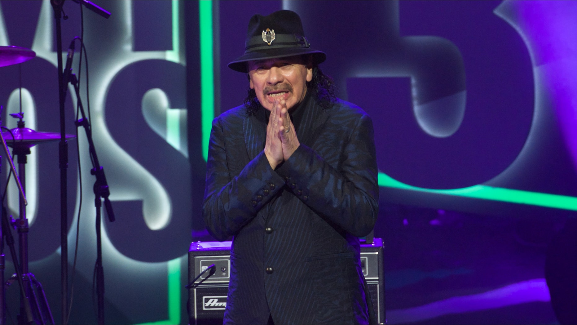 VALLADOLID, SPAIN - MARCH 07: Carlos Santana receives the Cadena Dial award during the Cadena Dial 2013 awards ceremony at the Miguel Delibes auditorium on March 7, 2014 in Valladolid, Spain. (Photo by Carlos Alvarez/Getty Images)
