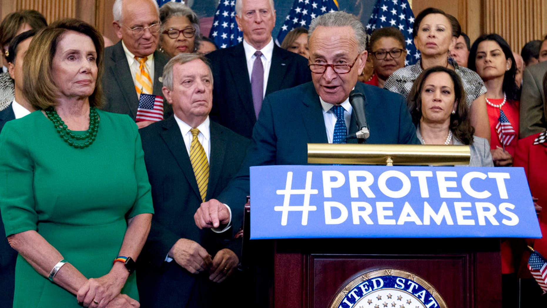 FILE - In this Sept. 6, 2017 file photo, Senate Minority Leader Chuck Schumer of N.Y., accompanied by House Minority Leader Nancy Pelosi of Calif., left, and others members of the House and Senate Democrats, speaks during a news conference on Capitol Hill in Washington. Itâs beginning to look like Congressâ election-year battle over immigration could end up in stalemate or a narrowly focused bill. The kind of broader measure that President Donald Trump has proposed is running into trouble. The reasons: Deep gaps between the two parties, internal divisions particularly among Republicans and political incentives that might leave each side content with a minimal compromise or even nothing at all. ( AP Photo/Jose Luis Magana)