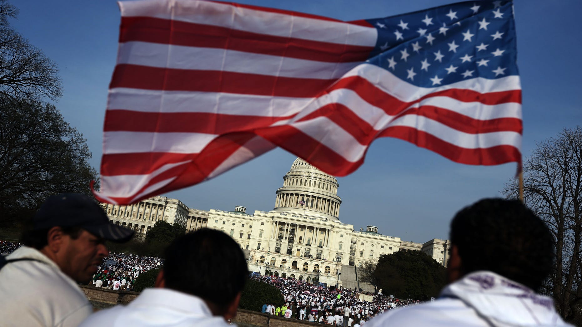 WASHINGTON, DC - APRIL 10: Immigration activists gather on the West Lawn of the U.S. Capitol for an All In for Citizenship rally April 10, 2013 on Capitol Hill in Washington, DC. Tens of thousands of reform supporters gathered for the rally to call on Congress to act on proposals that would grant a path to citizenship for an estimated 11 million of the nation's illegal immigrants. (Photo by Alex Wong/Getty Images)