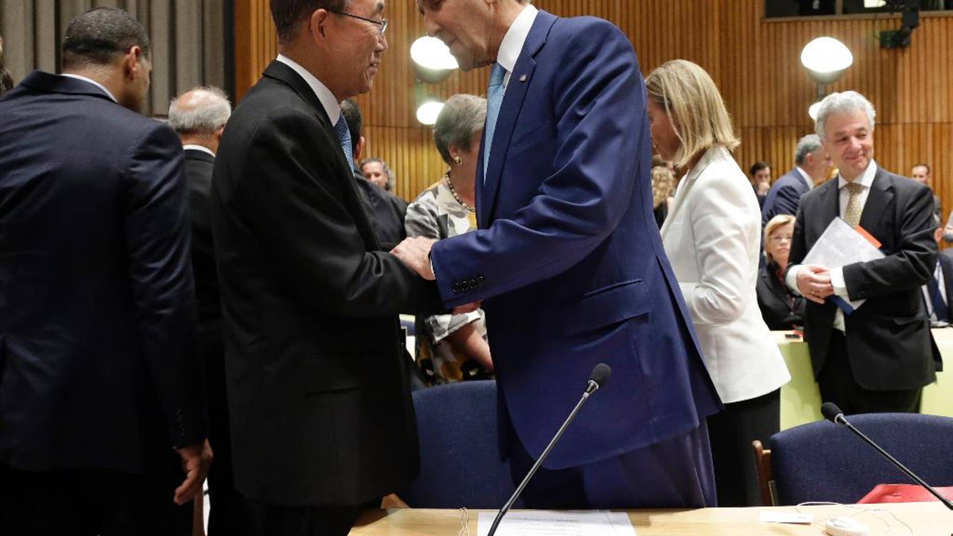 United Nations Secretary General Ban Ki-moon, left, greets U.S. Secretary of State John Kerry before the seventh Ministerial Meeting of the Comprehensive Nuclear-Test-Ban Treaty (CTBT) during the 69th session of the United Nations General Assembly at U.N. headquarters on Friday, Sept. 26, 2014. The meeting was co-organized by Australia, Canada, Finland, Germany, Japan and the Netherlands. (AP Photo/Pool, Jason Szenes)