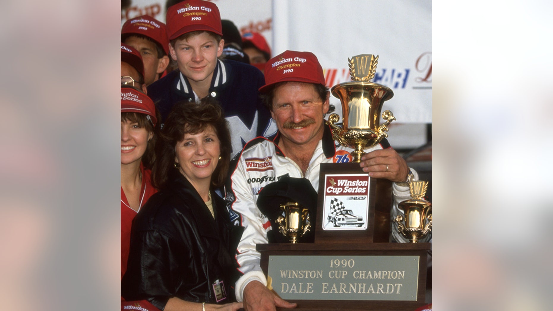 Dale Earnhardt and his son Dale Jr donned similar hats at the 1990 Winston Cup championship ceremony.