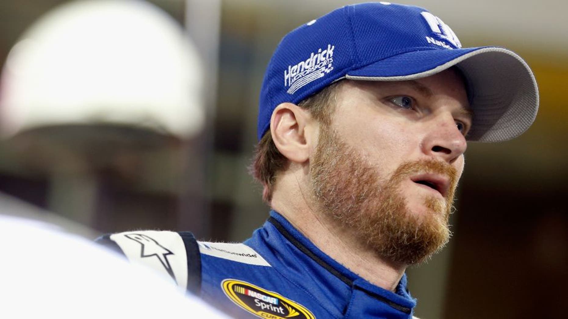HOMESTEAD, FL - NOVEMBER 20: Dale Earnhardt Jr., driver of the #88 Nationwide Chevrolet, stands on the grid during qualifying for the NASCAR Sprint Cup Series Ford EcoBoost 400 at Homestead-Miami Speedway on November 20, 2015 in Homestead, Florida. (Photo by Brian Lawdermilk/Getty Images)