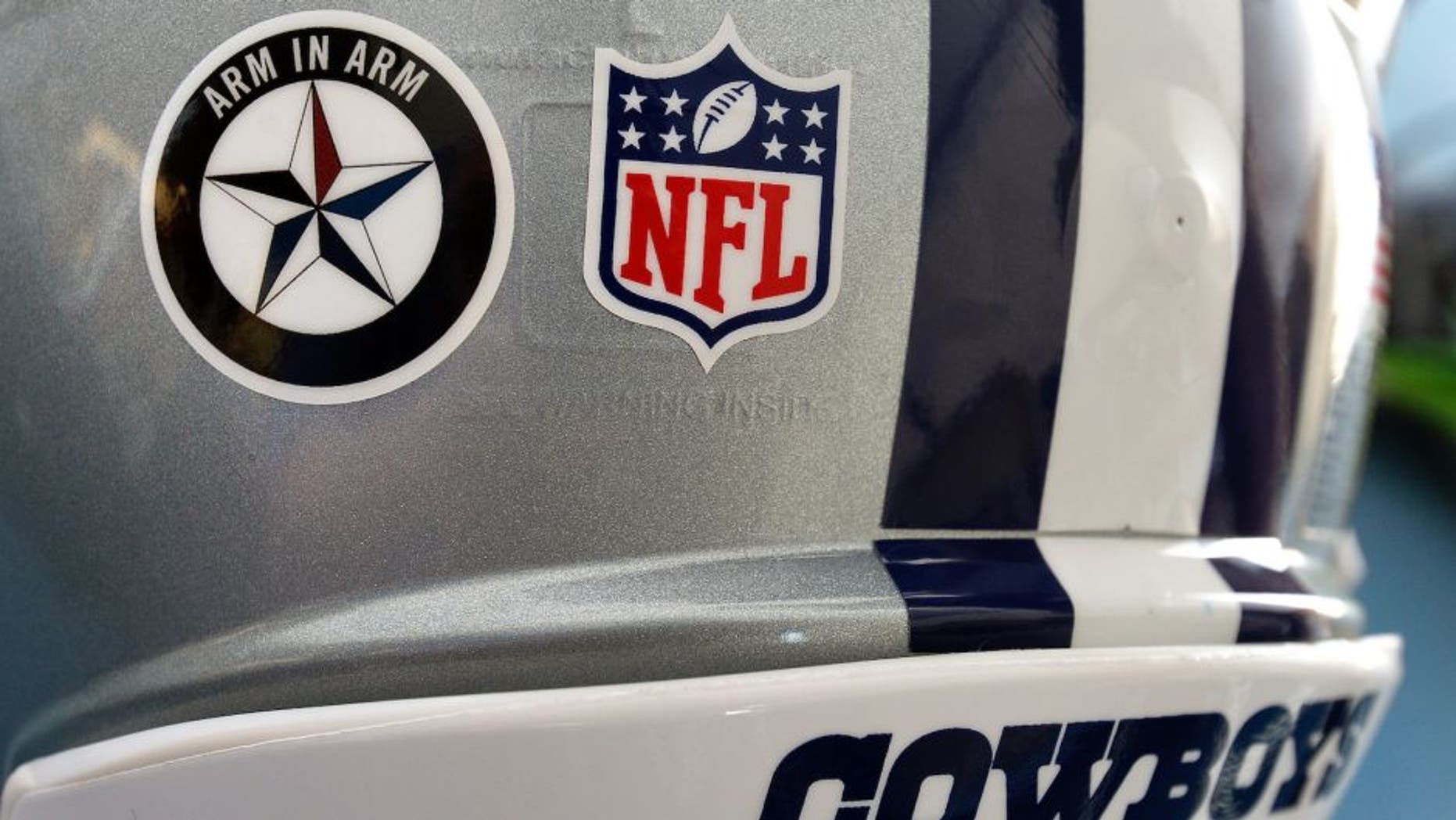 A sticker in support of the Dallas Police department on the Dallas Cowboys' helmets during training camp in Oxnard, Calif., on Saturday, July 30, 2016. (Max Faulkner/Fort Worth Star-Telegram/TNS via Getty Images)