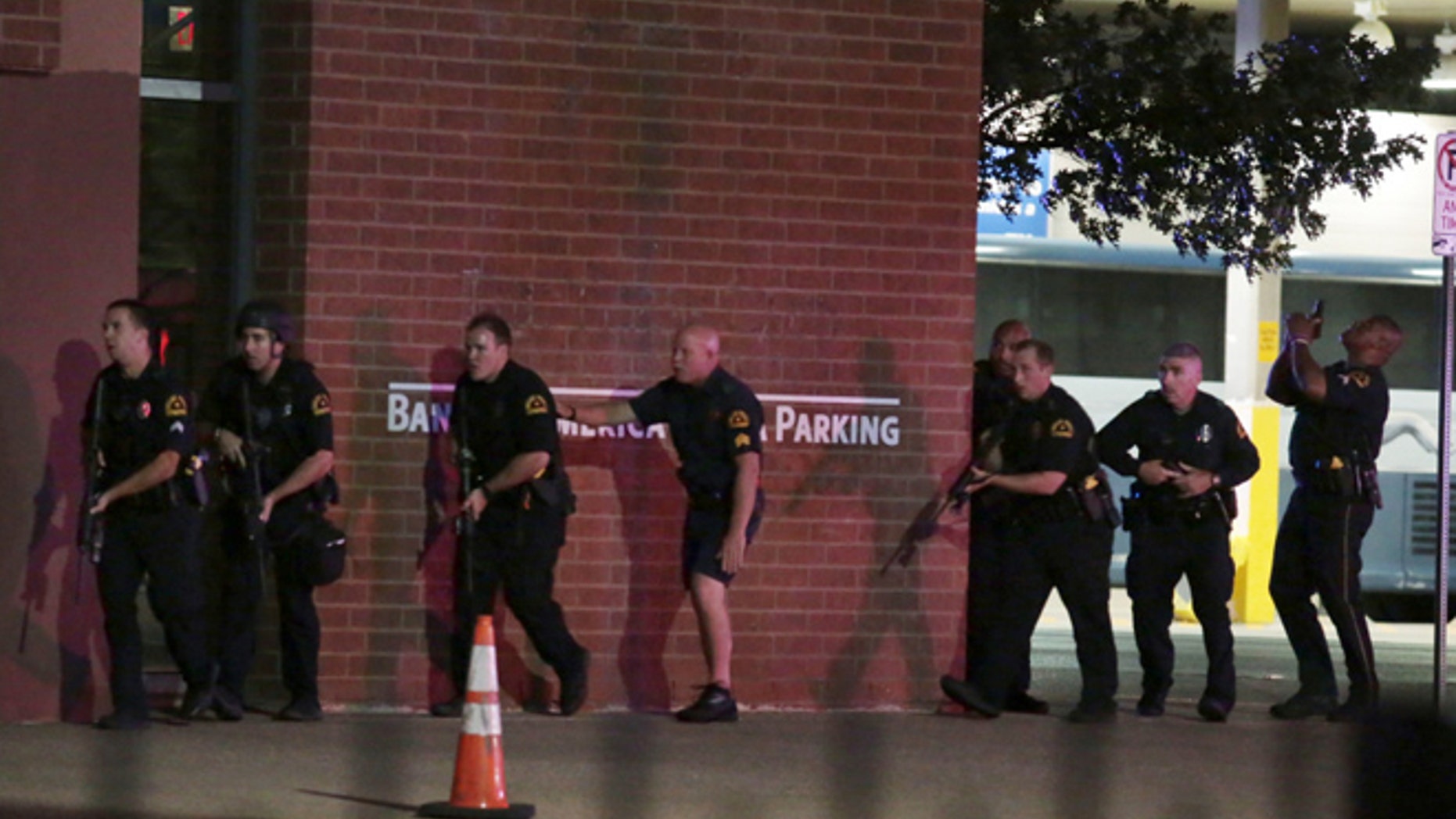 The sniper is believed to have fired from a downtown parking garage.