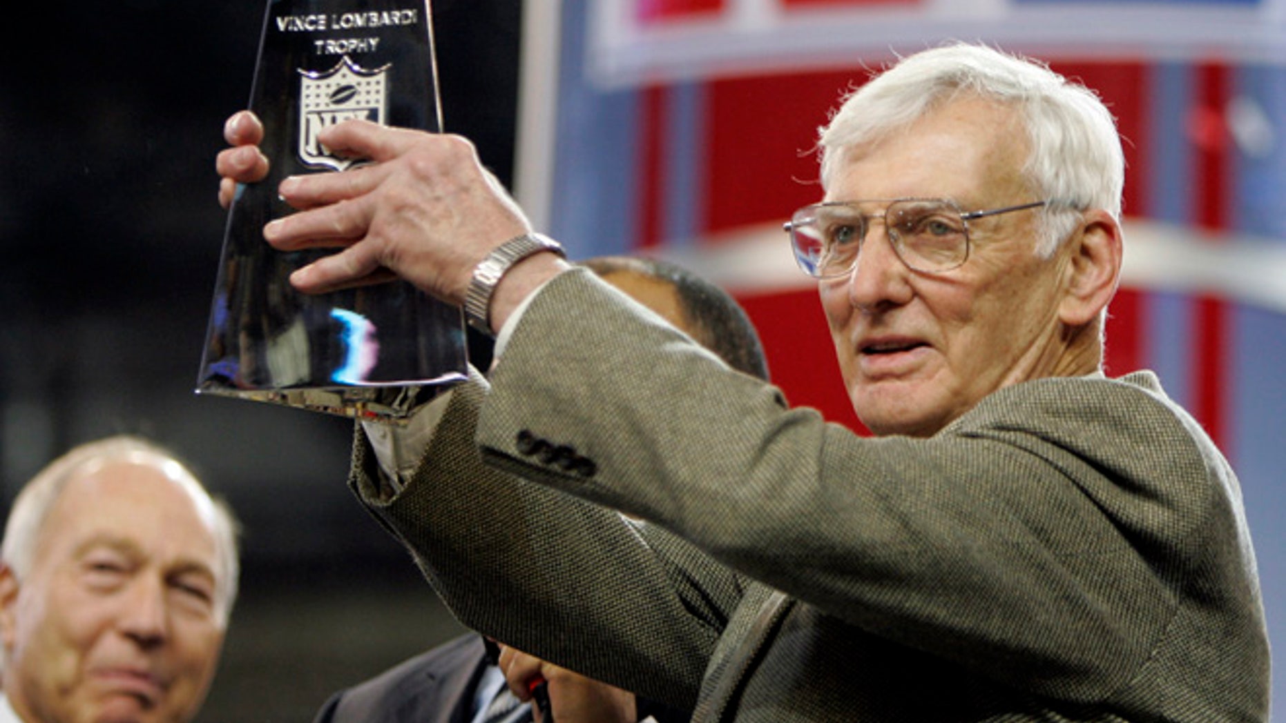 Dan Rooney, right, holding up the Vince Lombardi Trophy in 2006.