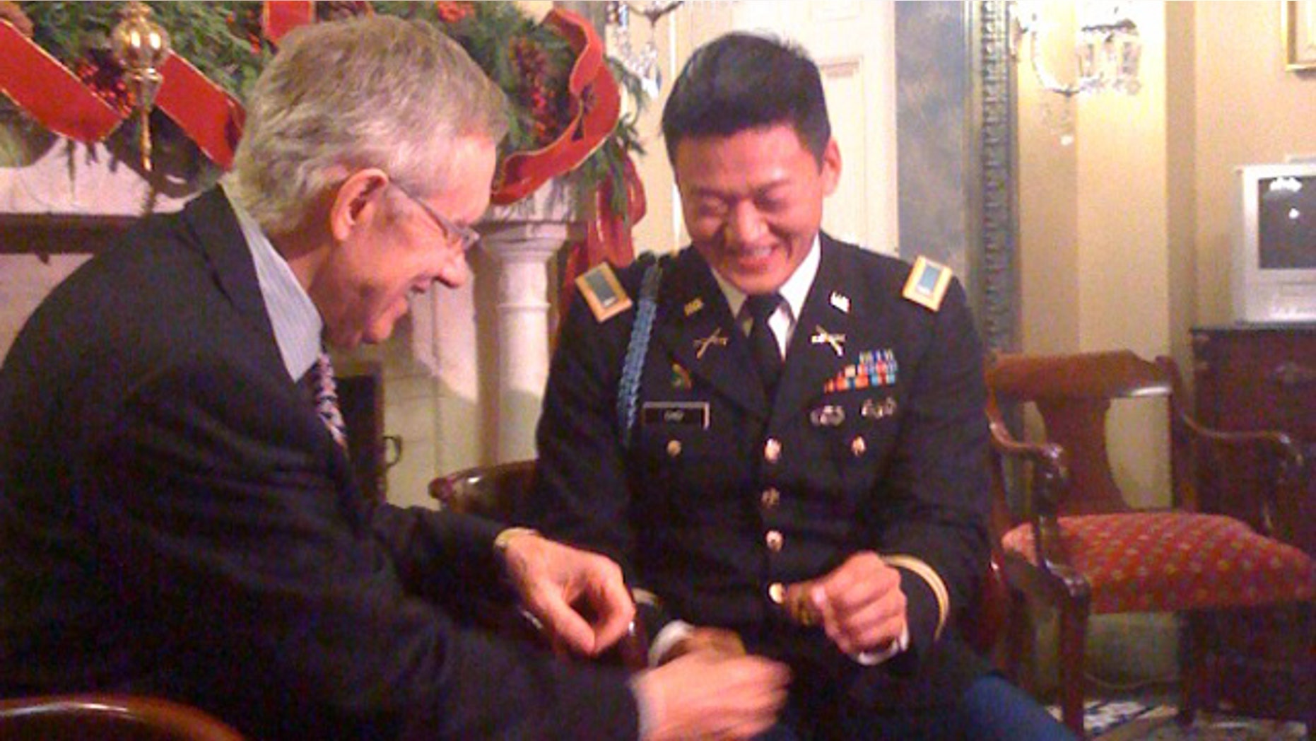 Wednesday: Senate Majority Leader Harry Reid hands gay rights activist Lt. Dan Choi his West Point graduation ring after President Obama signed the repeal of don't ask, don't tell.