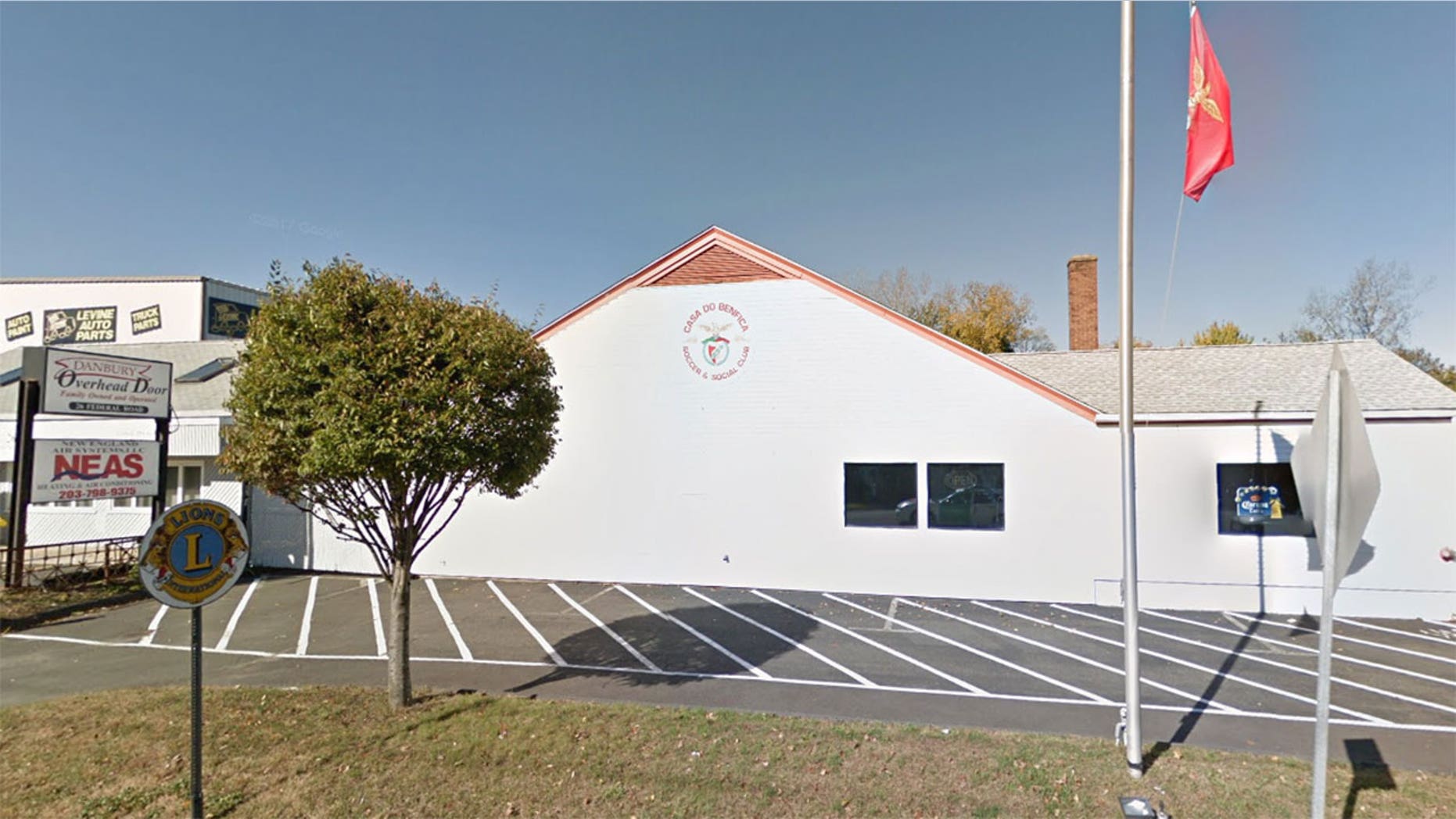 The man reportedly fell from the roof of the Danbury social club and onto a rotisserie stand.
