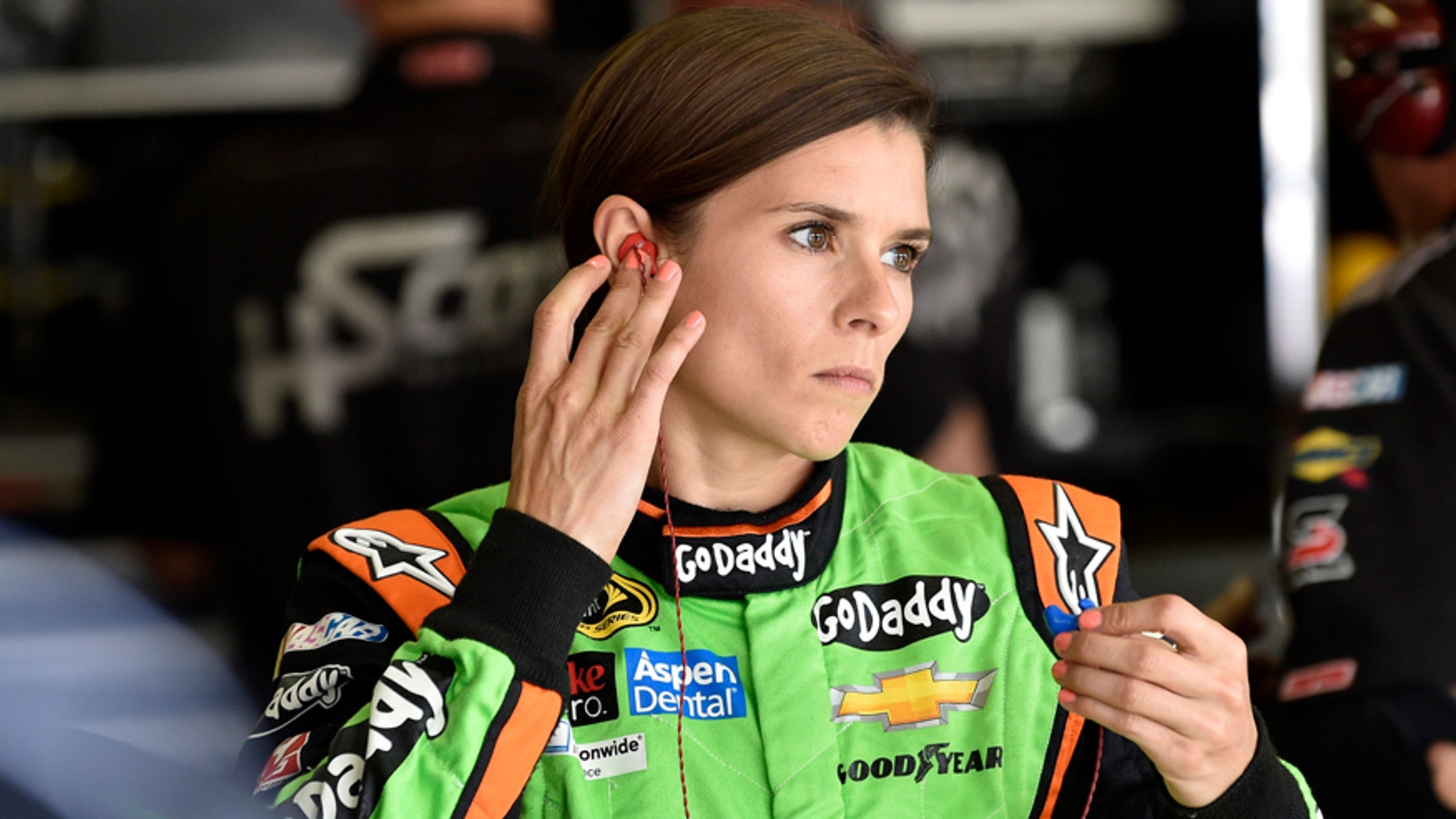 NASCAR driver Danica Patrick gets ready to practice for Sunday's NASCAR auto race at Atlanta Motor Speedway in Hampton, Ga., Friday, Aug. 29, 2014. (AP Photo/David Tulis)