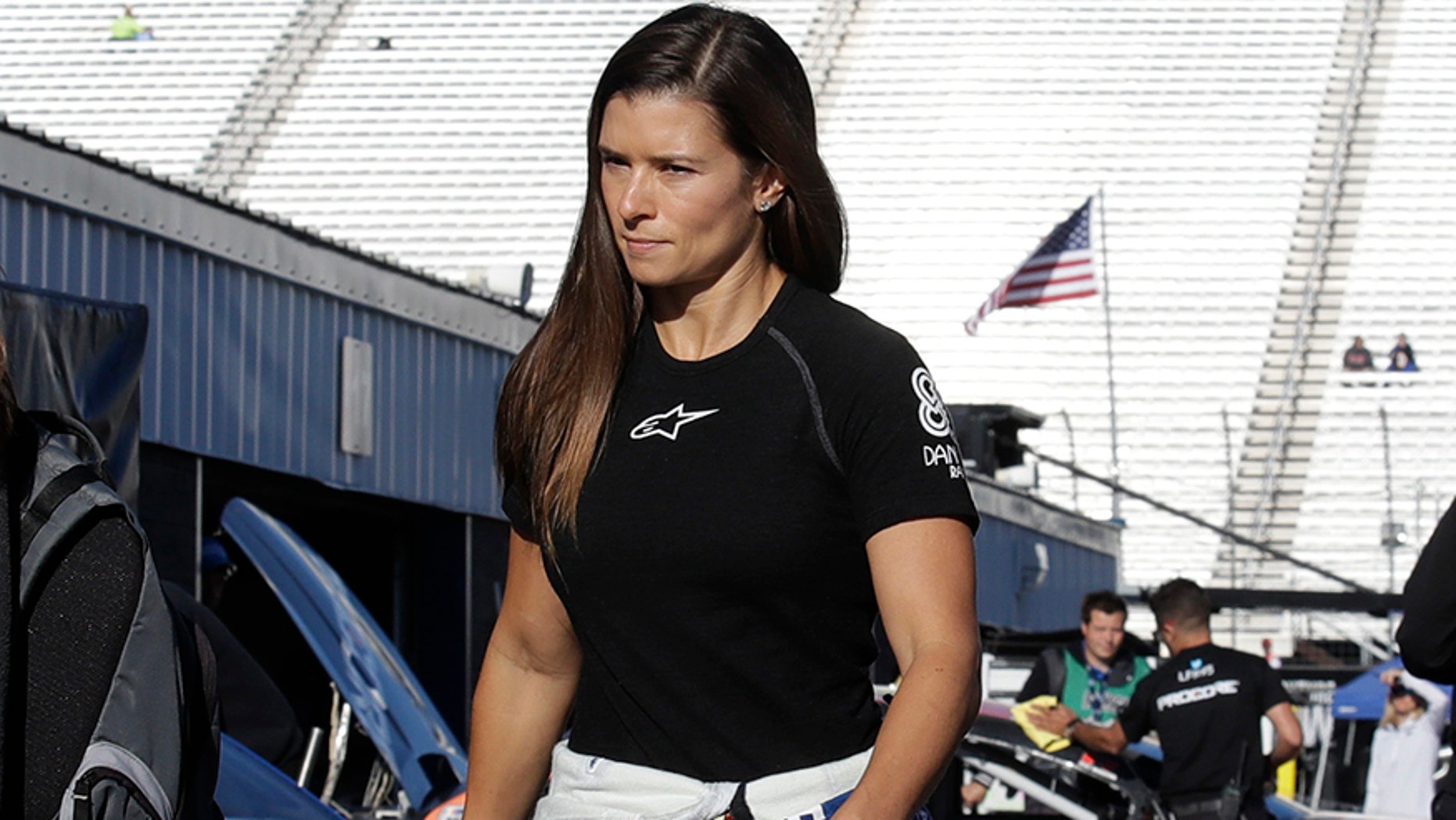 Danica Patrick walks to her garage prior to practice for the NASCAR Cup Series 300 auto race at New Hampshire Motor Speedway in Loudon, N.H., Saturday, Sept. 23, 2017. (AP Photo/Charles Krupa)