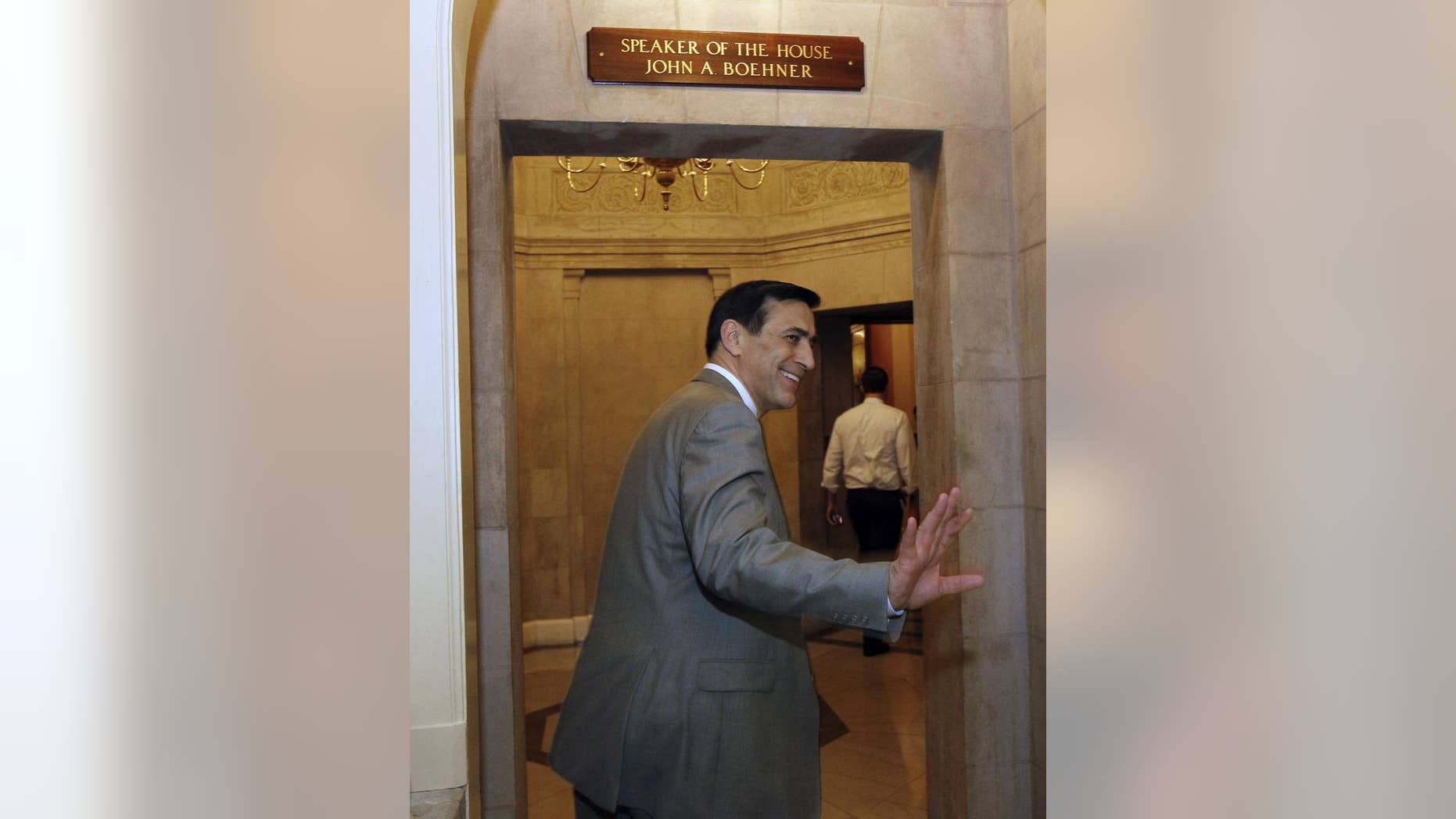 Rep. Darrell Issa, R-Calif., goes into Speaker John Boehner's office on Capitol Hill Friday, April 8, 2011 in Washington.(AP Photo/Alex Brandon)