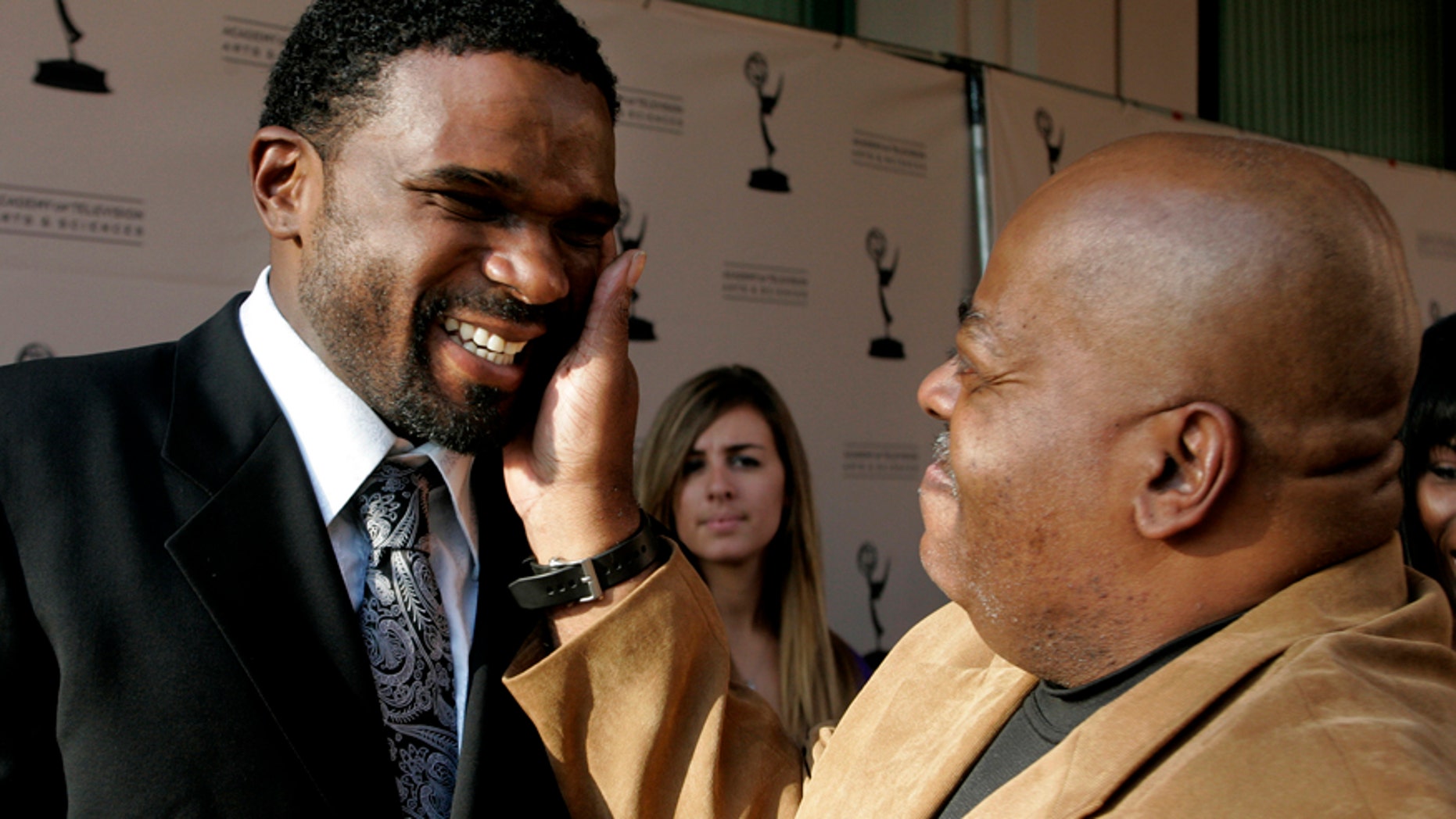 Darius McCrary (L) is greeted by Reginald VelJohnson, his "Family Matters" TV dad, as they arrive for "A Father's Day Salute to TV Dads" hosted by the Academy of Television Arts & Sciences in Los Angeles, California, June 18, 2009. (Reuters)
