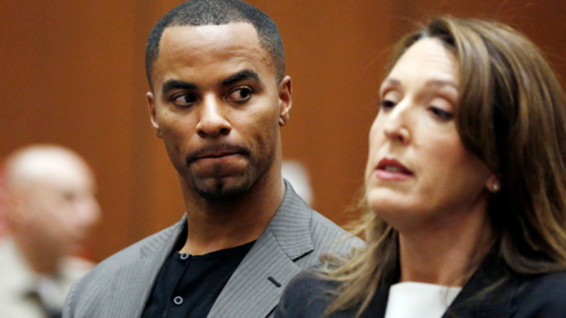 In this Feb. 20, 2014, file photo, Darren Sharper looks toward his attorney, Blair Berk, during an appearance in Los Angeles Superior Court in Los Angeles.