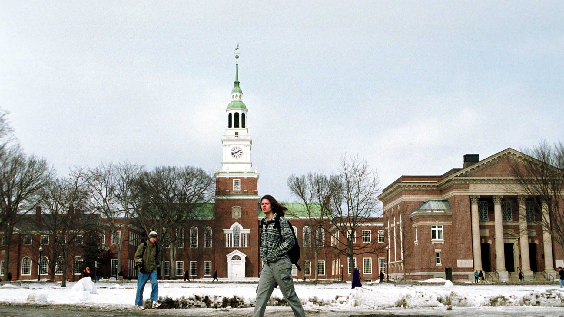 A Dartmouth College student walks across the main campus. (Photo by Darren McCollester/Newsmakers)