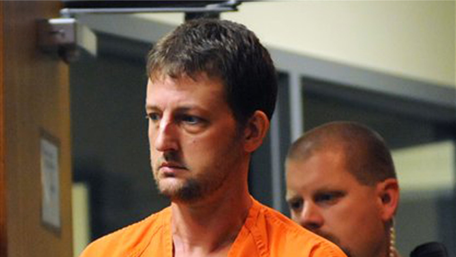 July 24, 2012: Aaron Schaffhausen, who is accused of killing his three daughters, enters a St. Croix County, Wis., court room for a preliminary hearing.