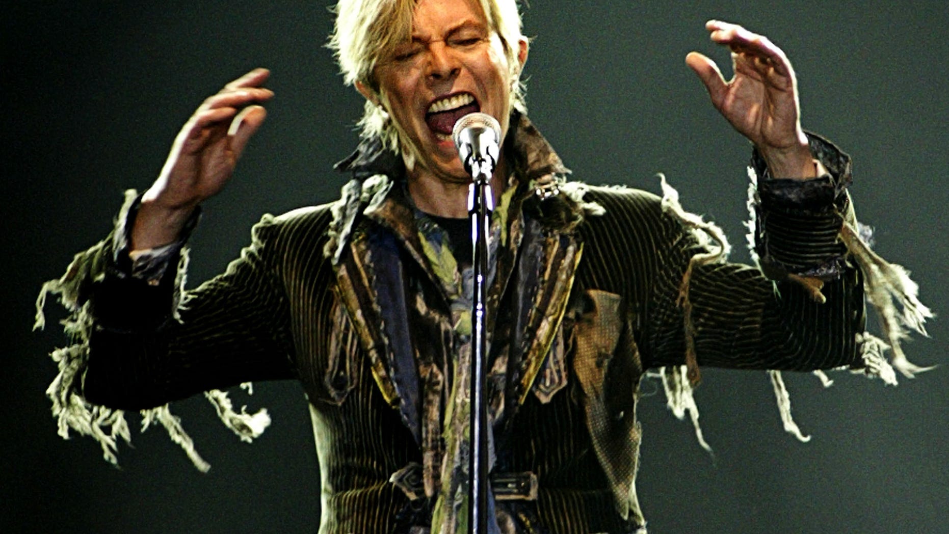 June 23, 2004. British singer David Bowie performs in a concert during his worldwide tour called "A Reality Tour" at T-mobile arena in Prague.