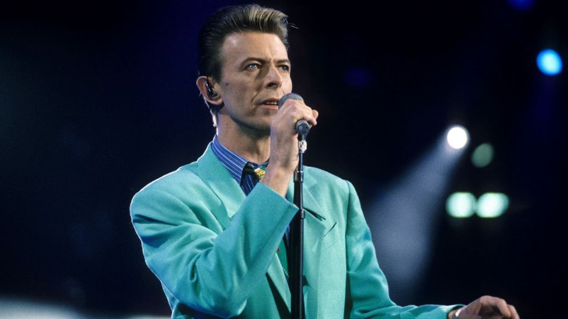 David Bowie performs "Under Pressure" (Photo by Kevin Mazur Archive/WireImage)