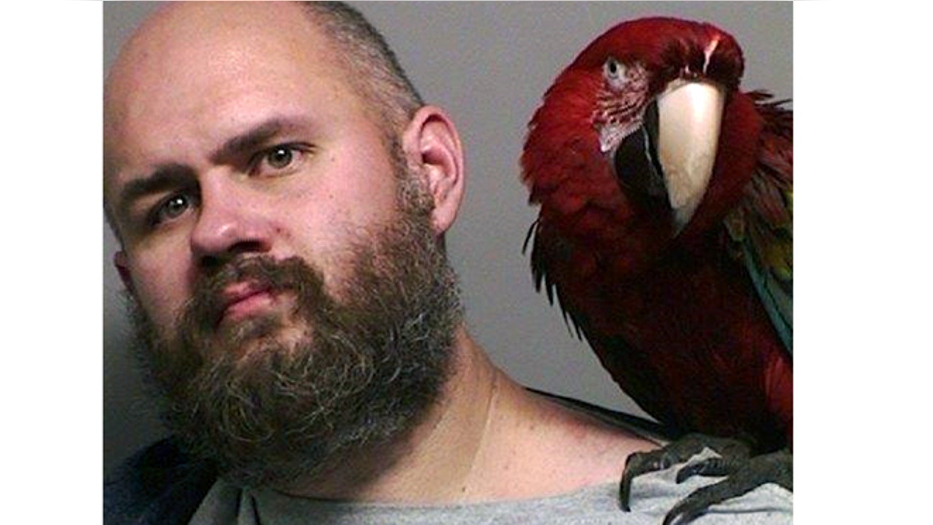 Mug shot for Craig Buckner and his macaw, "Bird."