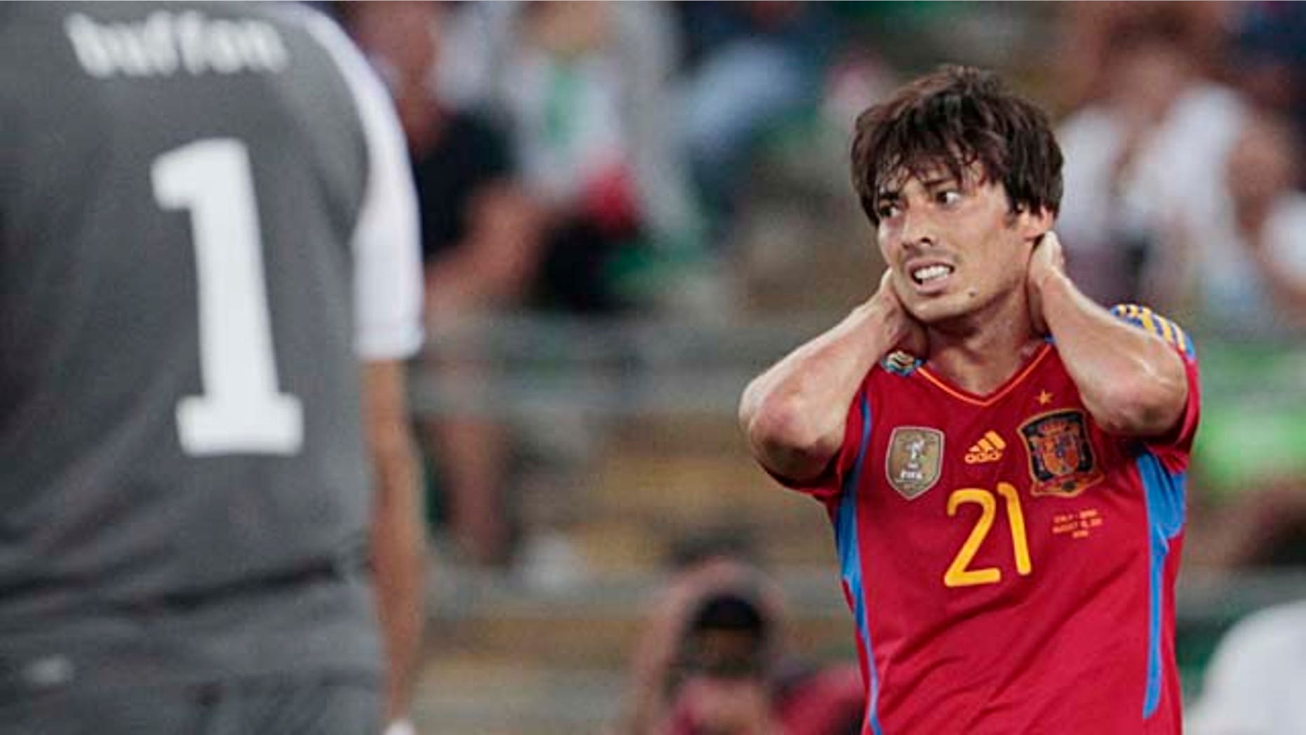 Spain's David Silva reacts after missing a scoring chance during a friendly soccer match against Italy in Bari, Italy, Wednesday, Aug. 10, 2011. Italy won 2-1. (AP Photo/Gregorio Borgia)