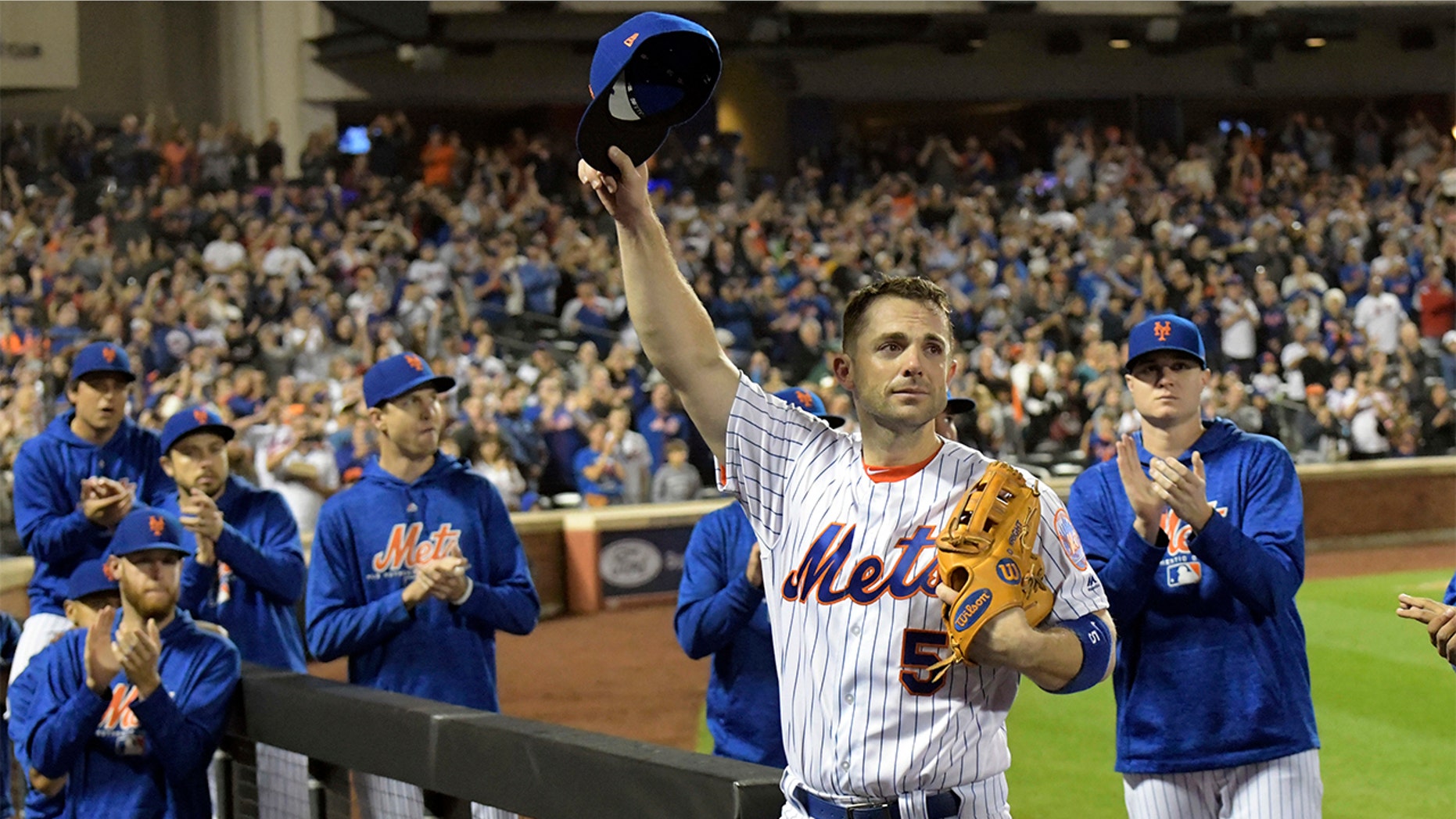 David Wright acknowledges the fans as he leaves the field after coming out of a baseball game during the fifth inning against the Miami Marlins, Saturday, Sept. 29, 2018, in New York.