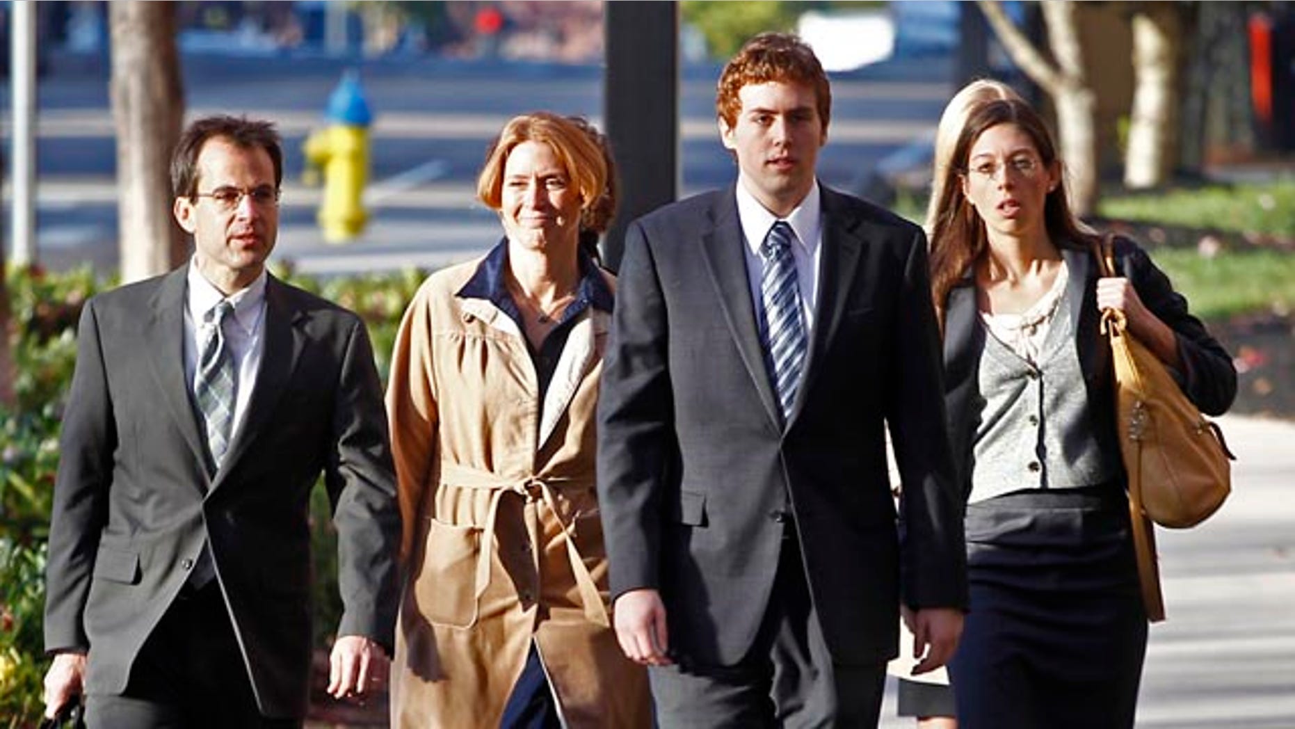 Nov. 12: David Kernell, third from left, walks to the Federal Courthouse with his mother, Lt. Col. Lillian Landrigan, second from left, and attorneys Wade Davies, far left, and Anne Passino, right, in Knoxville, Tenn.