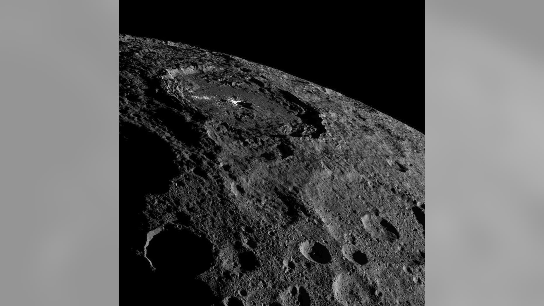 The strange bright spots of Occator Crater on the dwarf planet Ceres are unmistakable in this spectacular photo by NASA's Dawn spacecraft taken on Oct. 17, 2016 and released on Nov. 18 as Dawn moves into a higher orbit.