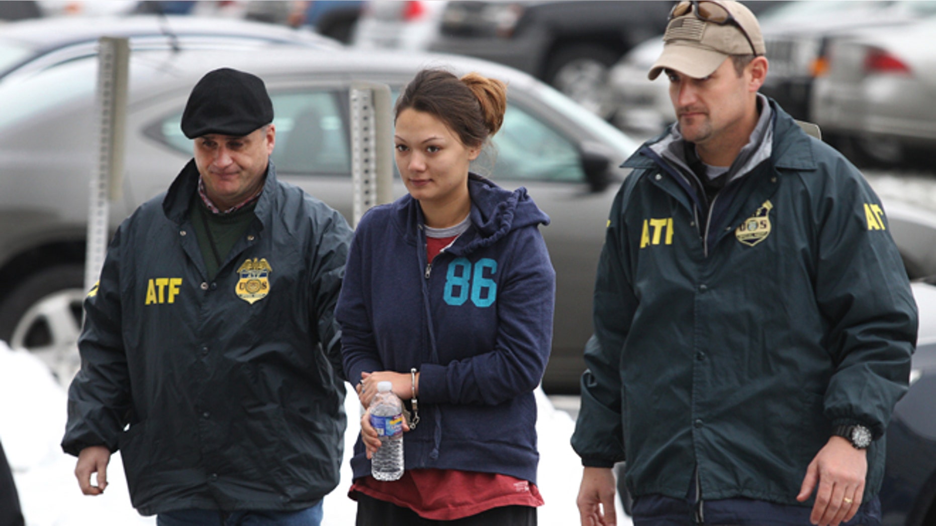 Dec. 28, 2012: Dawn Nguyen is escorted into the Federal Building in Rochester, N.Y., and charged in connection with the guns used in the Christmas Eve ambush slaying of two volunteer firefighters responding to a house fire in Webster, N.Y.