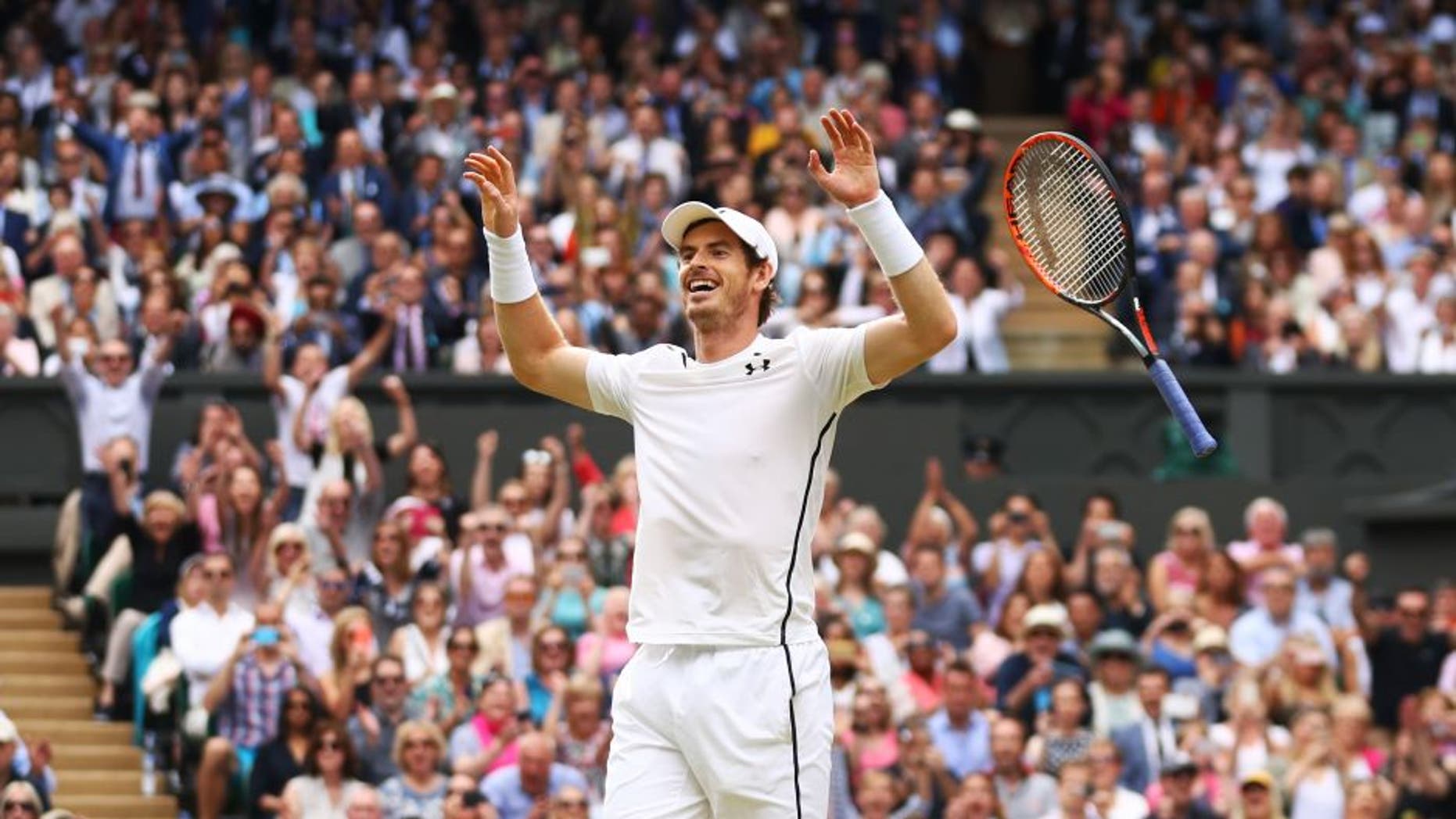 LONDON, ENGLAND - JULY 10: Andy Murray of Great Britain celebrates victory during the Men's Singles Final against Milos Raonic of Canada on day thirteen of the Wimbledon Lawn Tennis Championships at the All England Lawn Tennis and Croquet Club on July 10, 2016 in London, England. (Photo by Julian Finney/Getty Images)