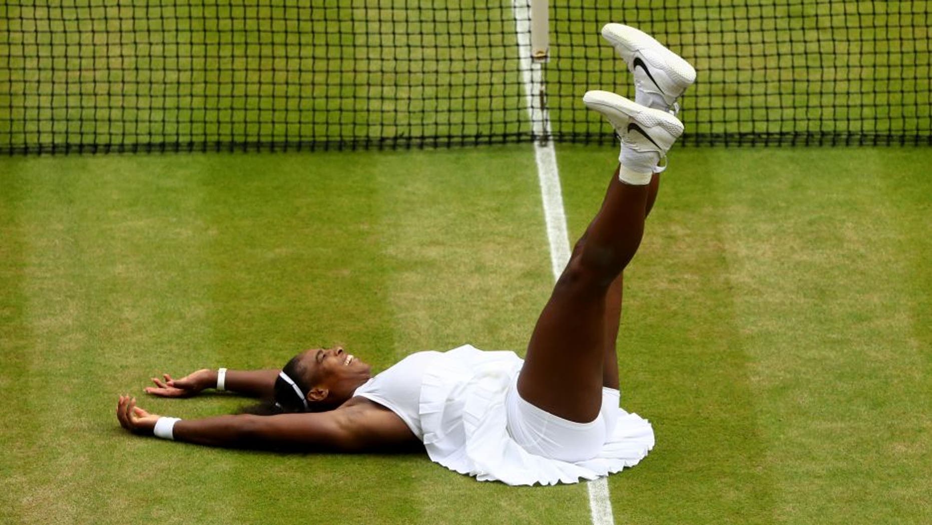 LONDON, ENGLAND - JULY 09: Serena Williams of The United States celebrates victory following The Ladies Singles Final against Angelique Kerber of Germany on day twelve of the Wimbledon Lawn Tennis Championships at the All England Lawn Tennis and Croquet Club on July 9, 2016 in London, England. (Photo by Julian Finney/Getty Images)