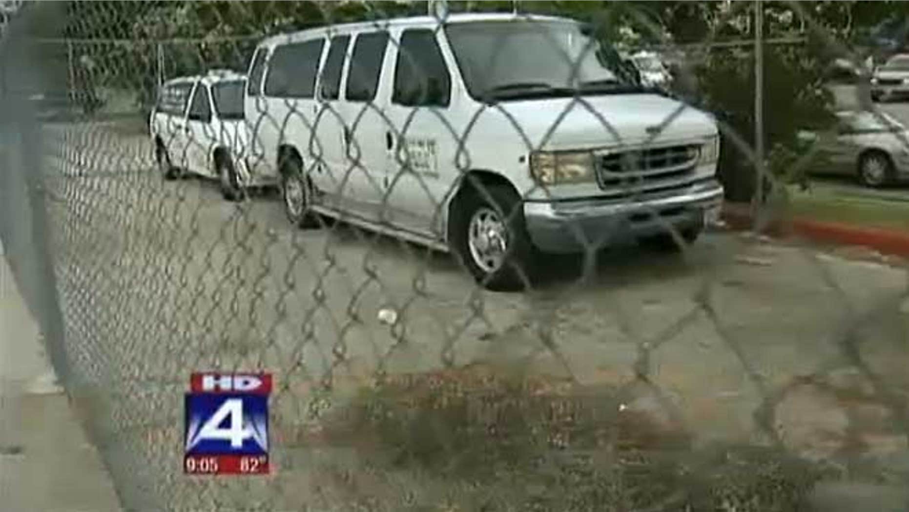 Vans outside Little T's Tiny Tots day care facility.