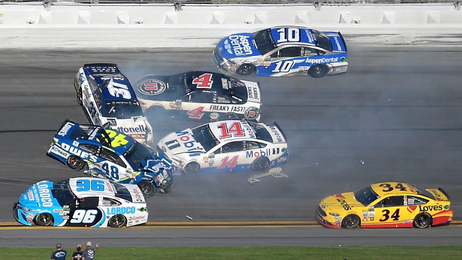 Feb. 26, 2017: Jimmie Johnson (48), Clint Bowyer (14), Chris Buescher (37), Kevin Harvick (4), D.J. Kennington (96) and Danica Patrick (10) collide in a multi-car wreck between Turns 3 and 4, as Landon Cassill (34) drives past.