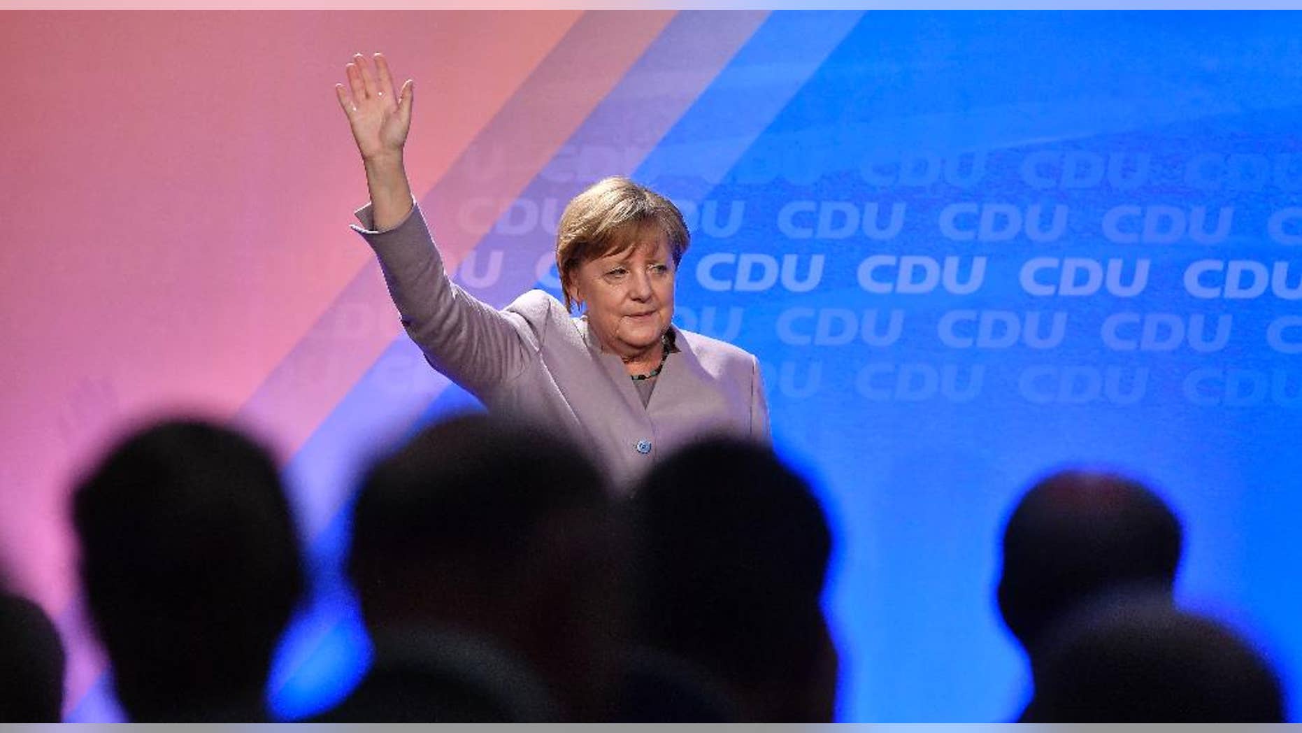 German chancellor Angela Merkel waves to supporters during an election campaign in Oelde, Germany, for the upcoming state elections in North Rhine-Westphalia, Thursday, April 27, 2017. Germany's most populated province elects a new parliament on May 14. (AP Photo/Martin Meissner)