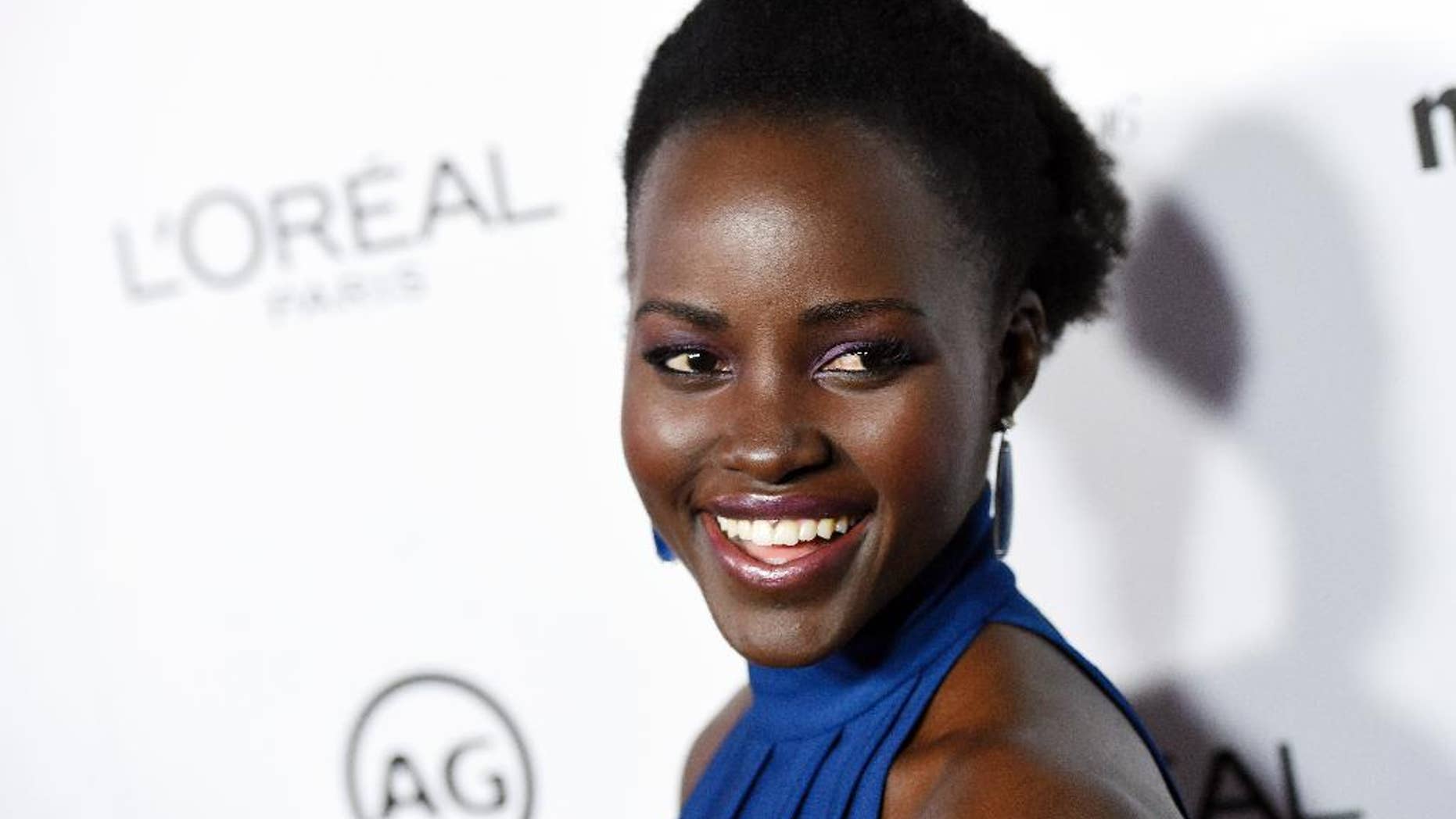 FILE - In this Jan. 12, 2016 file photo, actress Lupita Nyong'o poses at the Marie Claire Image Maker Awards in Los Angeles. Following a second straight year of all-white acting Oscar nominees, Nyong’o said Tuesday, Jan. 19, on Instagram she was joining in “calling for change in expanding the stories that are told and recognition of the people who tell them.” (Photo by Chris Pizzello/Invision/AP, FIle)