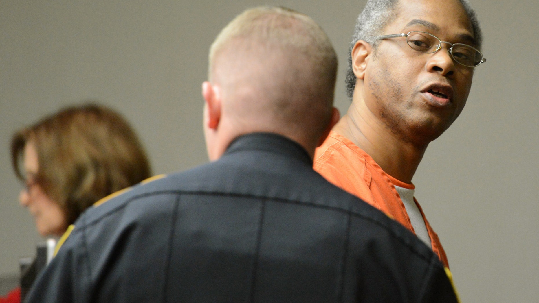In this Nov. 15, 2012 photo, Carl Henry Blue looks back at family and friends while being escorted back to jail after having his execution date set at the Brazos County Courthouse in Bryan, Texas. Blue never disputed filling a convenience store drink cup with gasoline, tossing it on his former girlfriend at the door of her apartment and setting her ablaze. Nineteen days after the September 1994 incident, 38-year-old Carmen Richards-Sanders died of her burns. Now, more than 18 years later, Blue, 48, is set to die Thursday, Feb. 21, 2013, evening for what he contended was a prank gone bad and for what prosecutors successfully argued was capital murder. Blue’s execution would be the first this year in Texas, the nation’s most active death penalty state. Fifteen inmates were executed last year. Blue is among at least 12 Texas prisoners scheduled for lethal injection in the coming months. (AP Photo/Bryan-College Station Eagle, Dave McDerman)