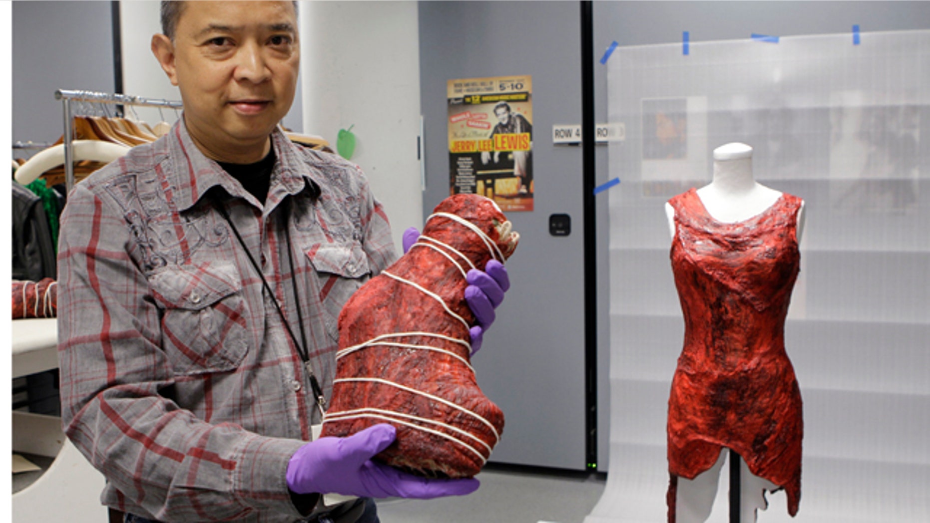 June 14: Jun Francisco, director of collections management at the Rock and Roll Hall of Fame and Museum, displays a boot and dress made of meat worn by Lady Gaga in the museum's vault.