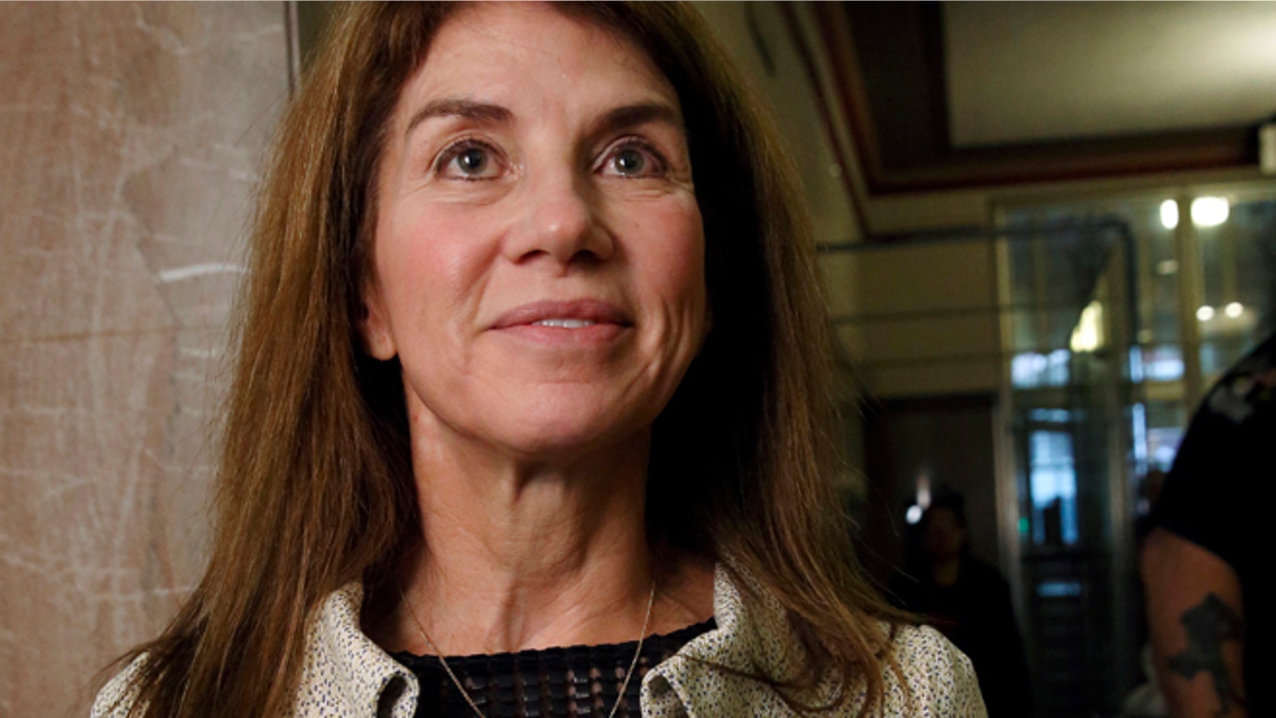 FILE: Sue Ann Hamm stands in the courthouse hall before divorce proceedings with Harold Hamm, founder and CEO of Continental Resources, in Oklahoma City, Oklahoma.