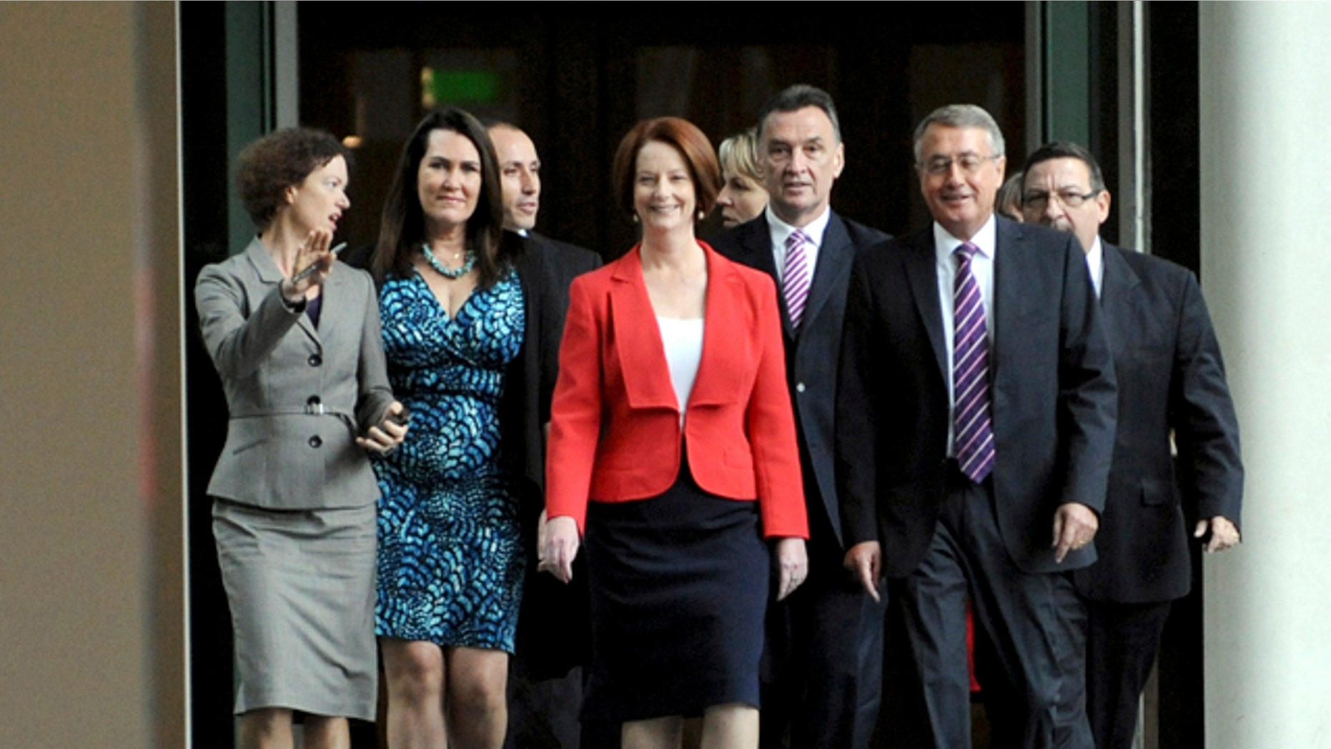 Feb. 27, 2012: Australian Prime Minister Julia Gillard, center, with supporters for the caucus meeting walks through the parliament house in Canberra, Australia.