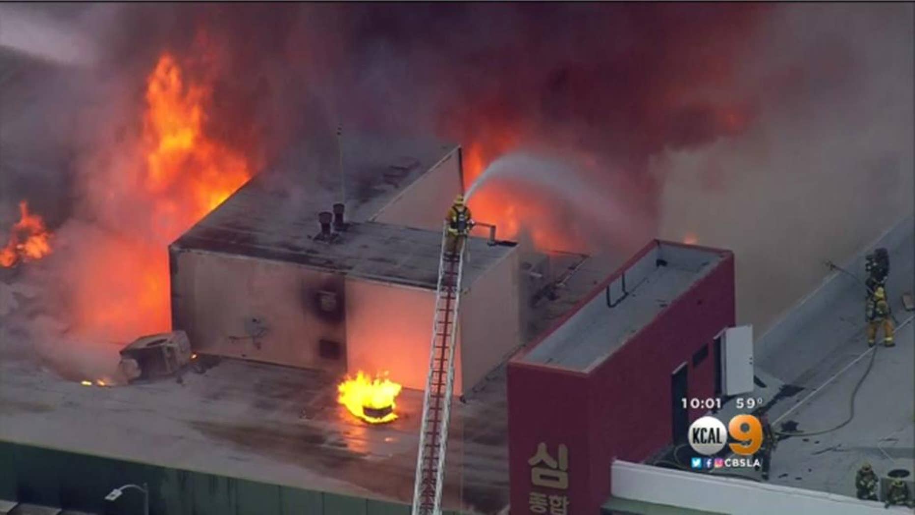 Firefighters battling the blaze on Monday.