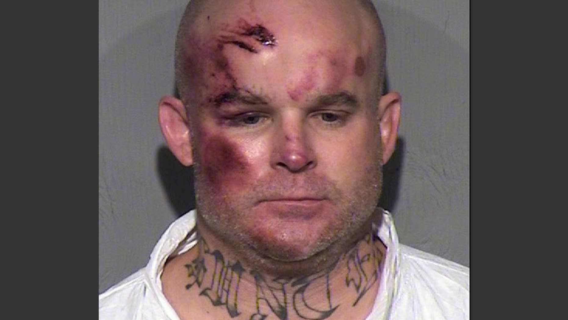 FILE - This undated file booking photo provided by the Maricopa County Sheriff's Office shows Ryan Giroux, 41, who Mesa police say committed a string of crimes that included a motel shooting, a carjacking and a home invasion that ended with the suspect's arrest on Wednesday, March 18, 2015. Giroux pleaded not guilty on Monday, April 6, 2015 to killing one person and wounding five others in a suburban Phoenix rampage that included multiple shootings, a carjacking and a home invasion. (AP Photo/Maricopa County Sheriff's Office,File)