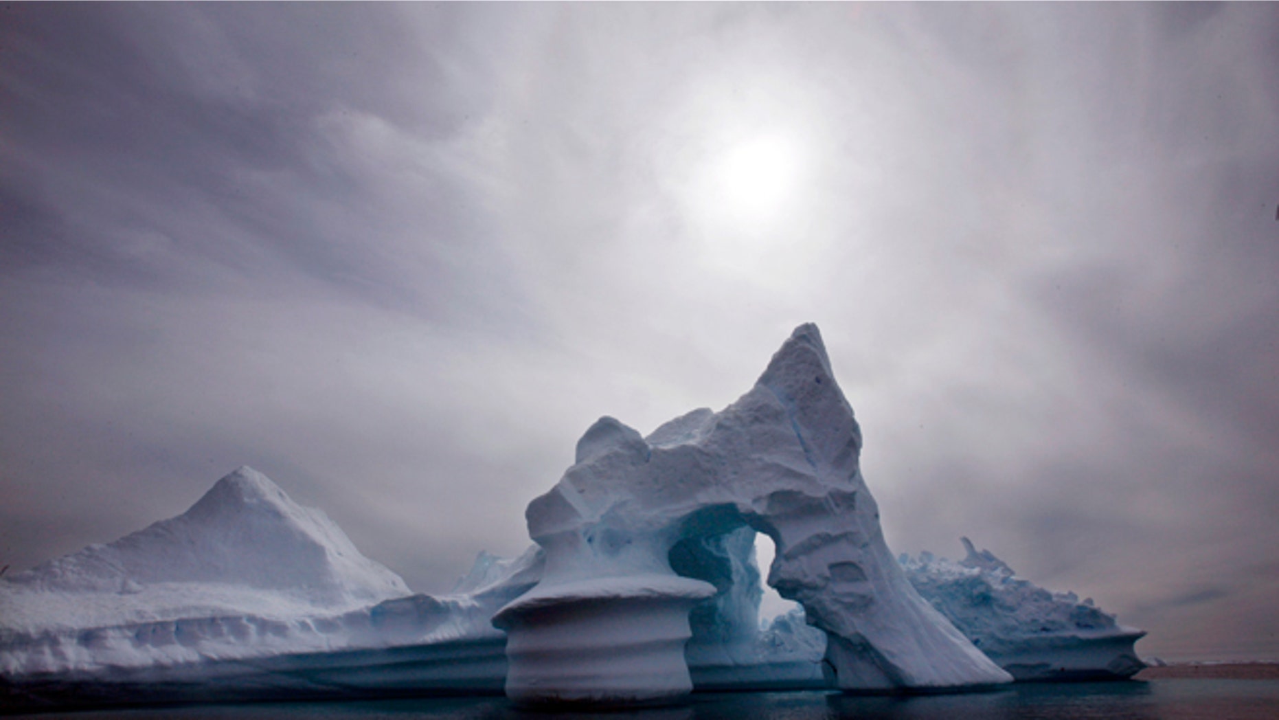 Scientists who are fine-tuning a landmark U.N. report on climate change are struggling to explain why global warming appears to have slowed down in the past 15 years even as greenhouse gas emissions keep rising.