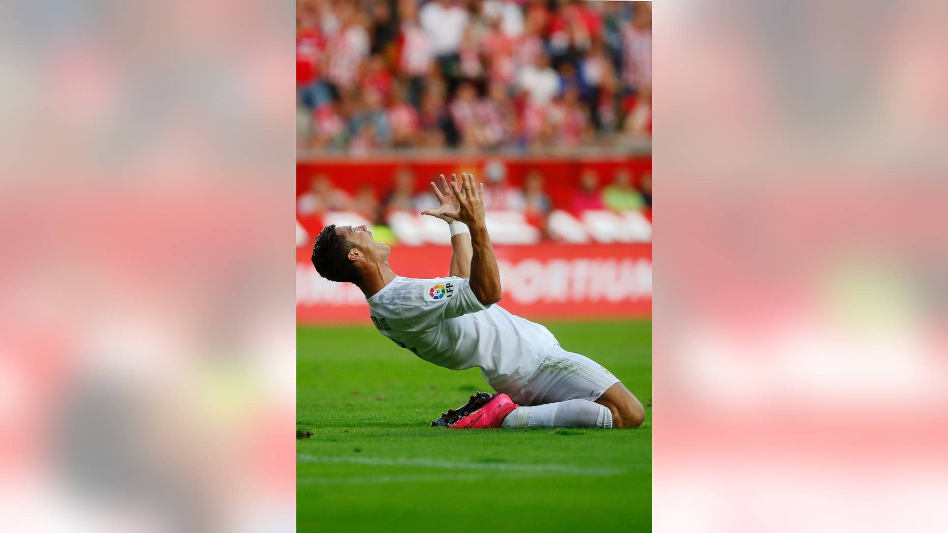 Real Madrid's Cristiano Ronaldo reacts during a Spanish La Liga soccer match between Real Madrid and Sporting de Gijon at the 'El Molinon' stadium in Gijon, Spain, Sunday, Aug. 23, 2015. (AP Photo/Jose Vicente)