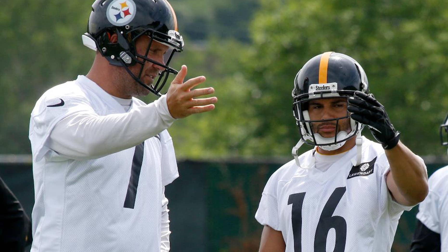 Pittsburgh Steelers quarterback Ben Roethlisberger (7) and wide receiver Lance Moore (16) talk about pass routes during an NFL football organized team activity on Wednesday, June 11, 2014 in Pittsburgh. (AP Photo/Keith Srakocic)